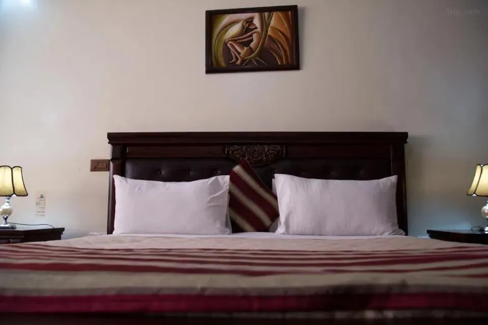 Bed in Hotel Karisimbi