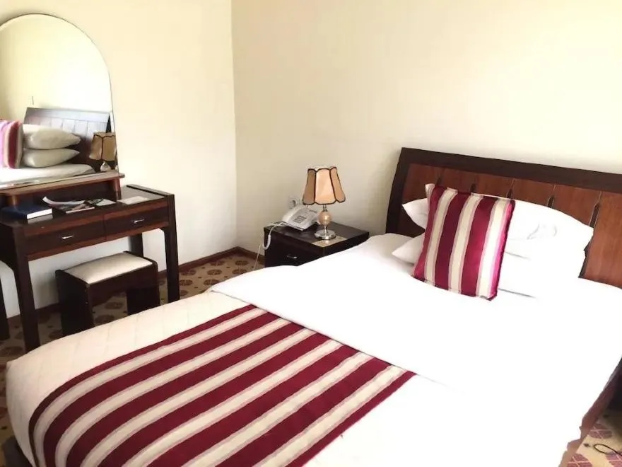 Bed in Hotel Karisimbi