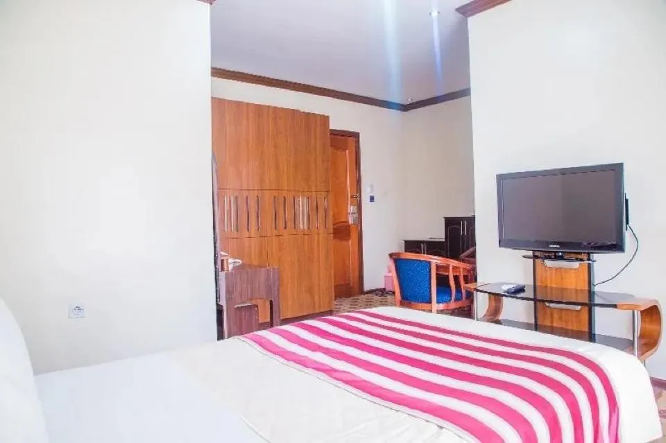 Bed in Hotel Karisimbi