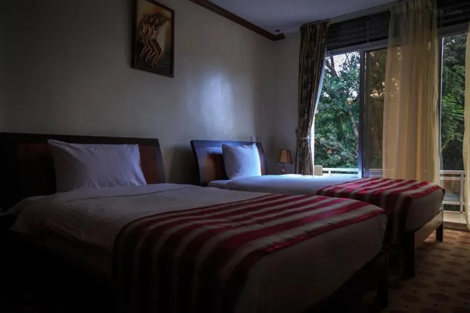 Bed in Hotel Karisimbi