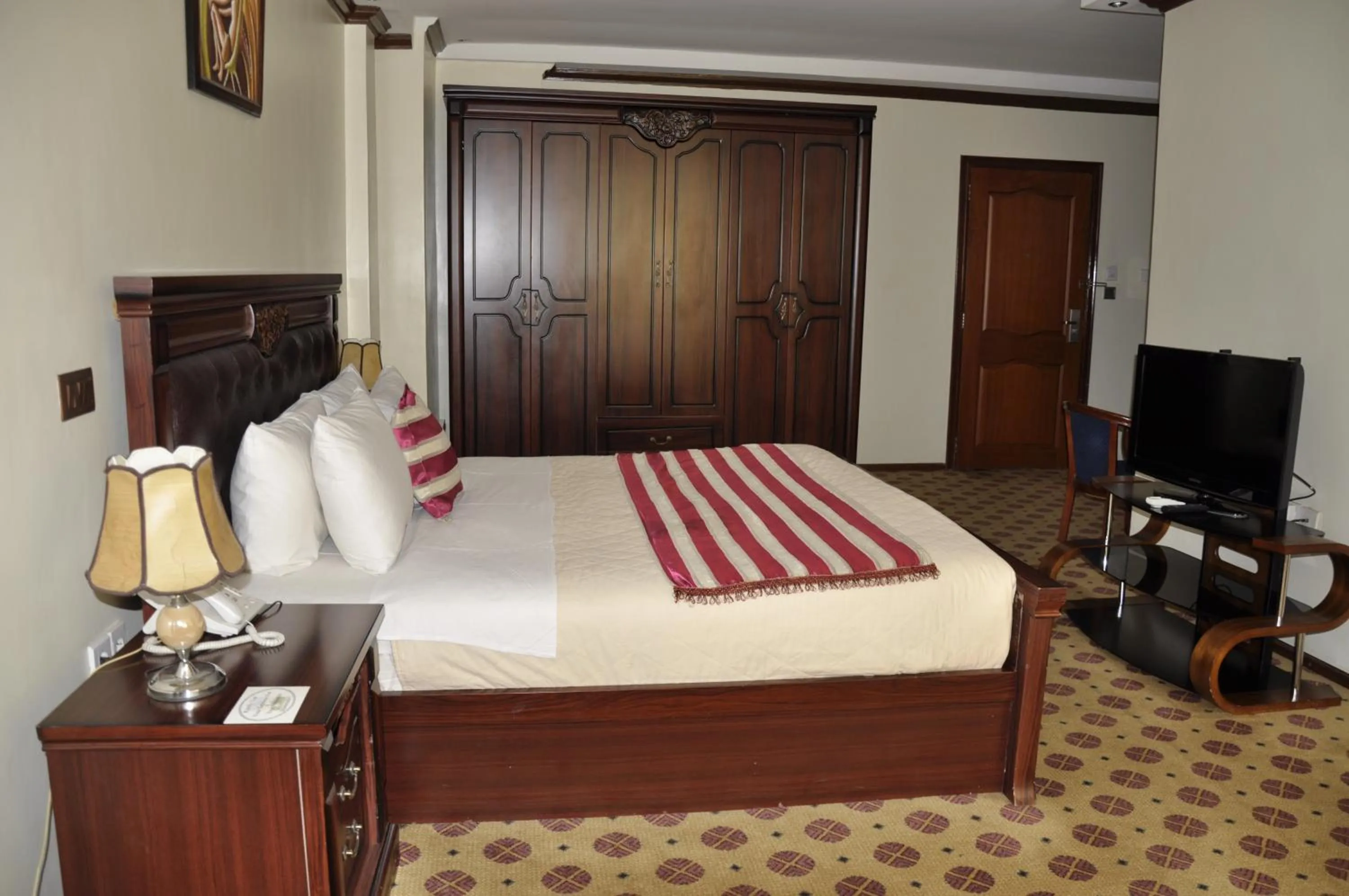 Bed in Hotel Karisimbi