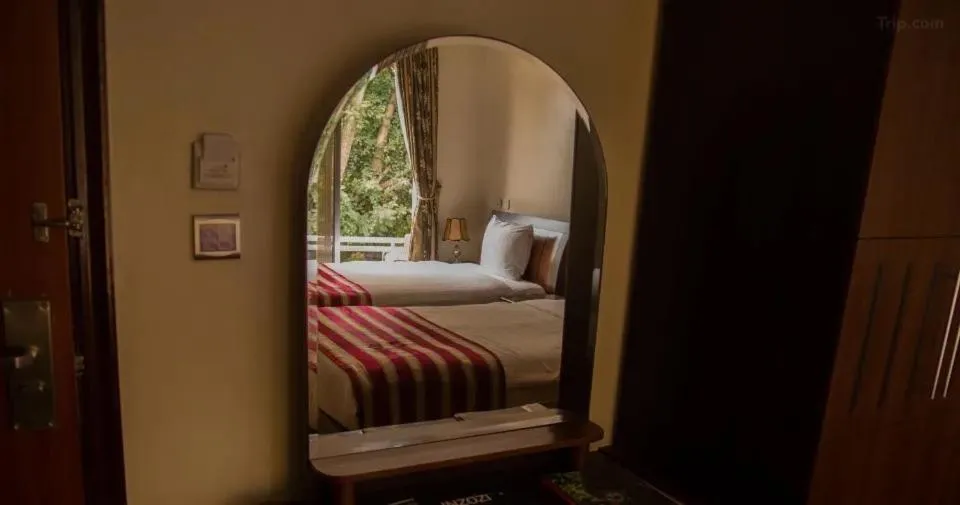 Bed in Hotel Karisimbi