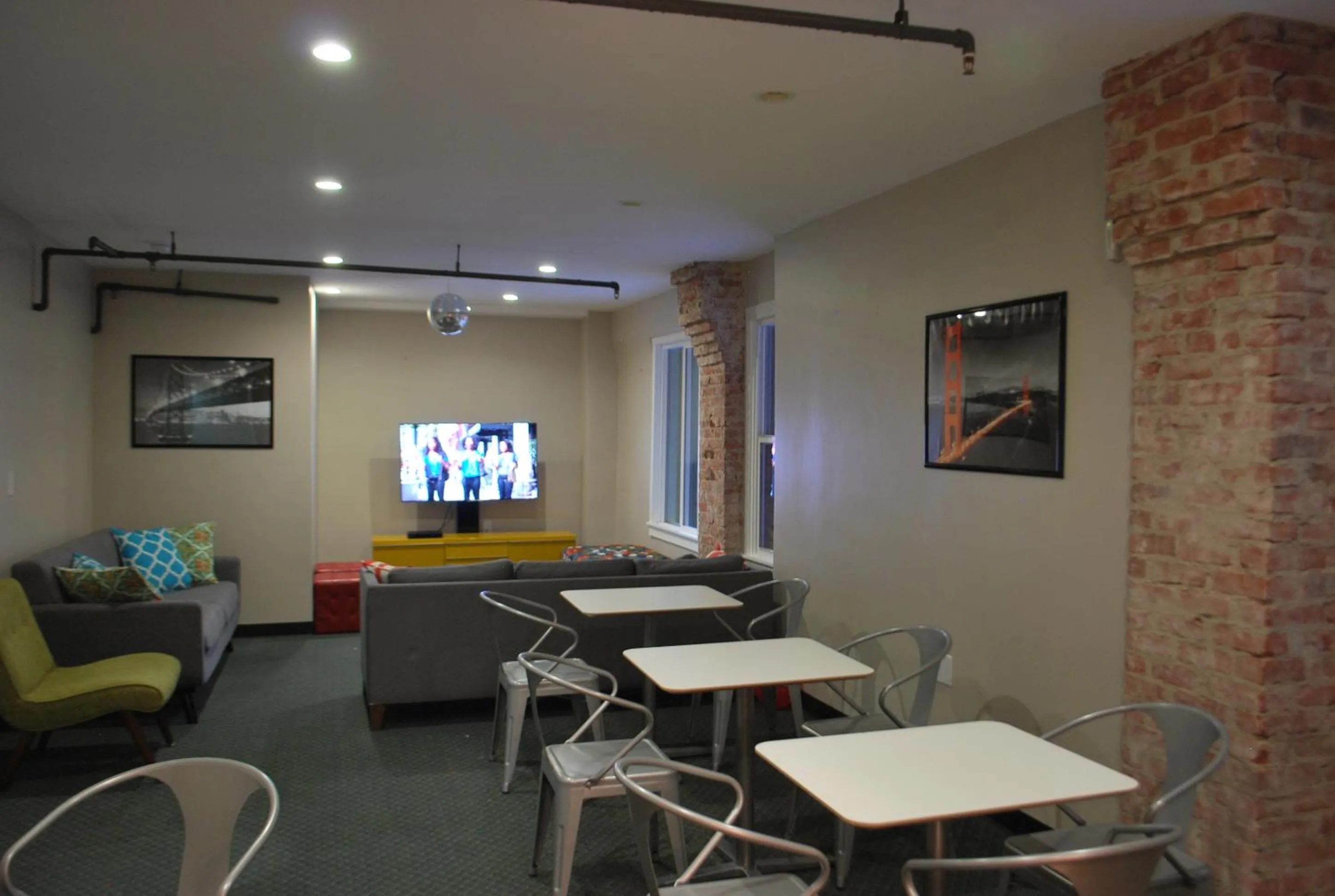 Communal lounge/ TV room in Orange Village Hostel