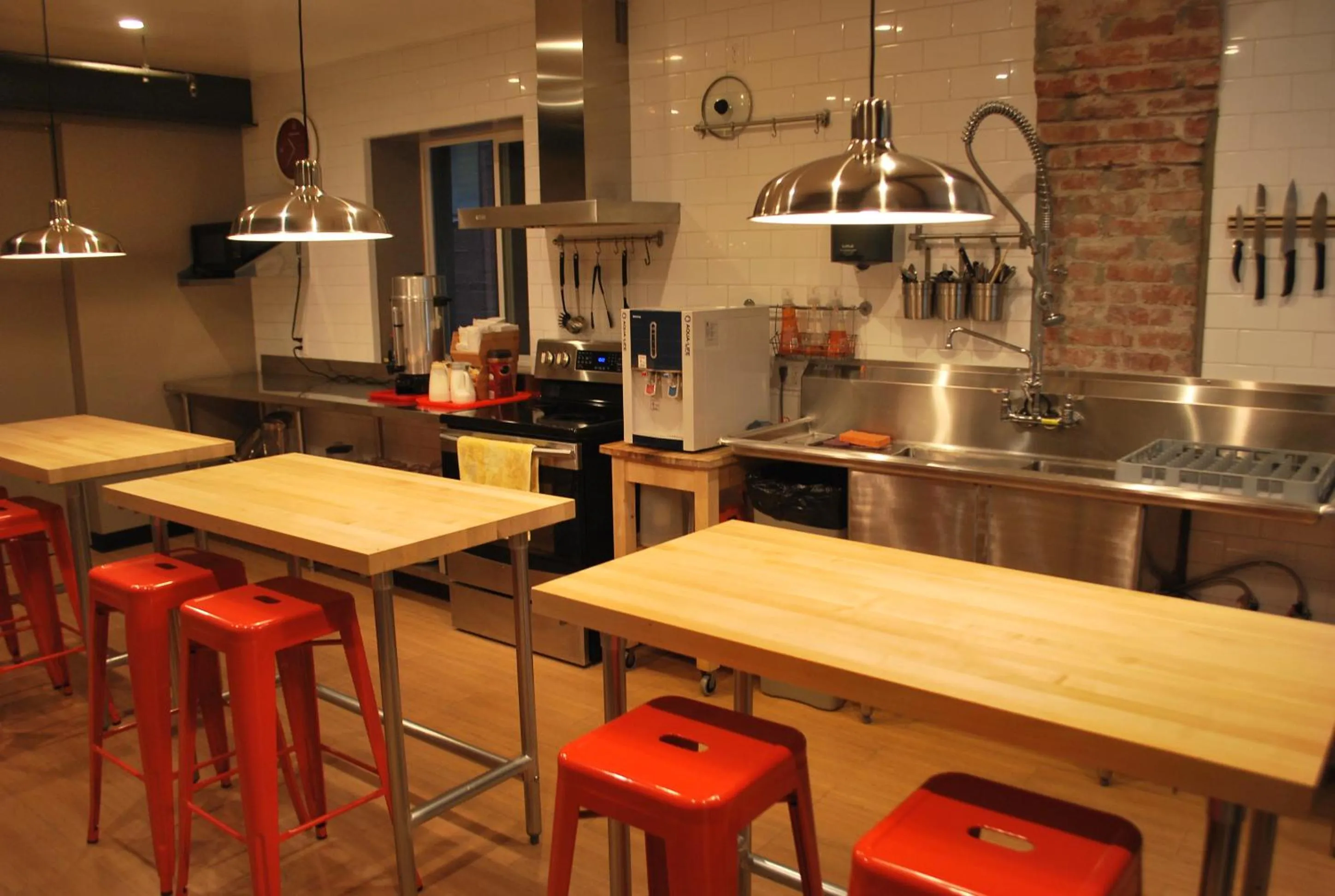 Communal kitchen in Orange Village Hostel