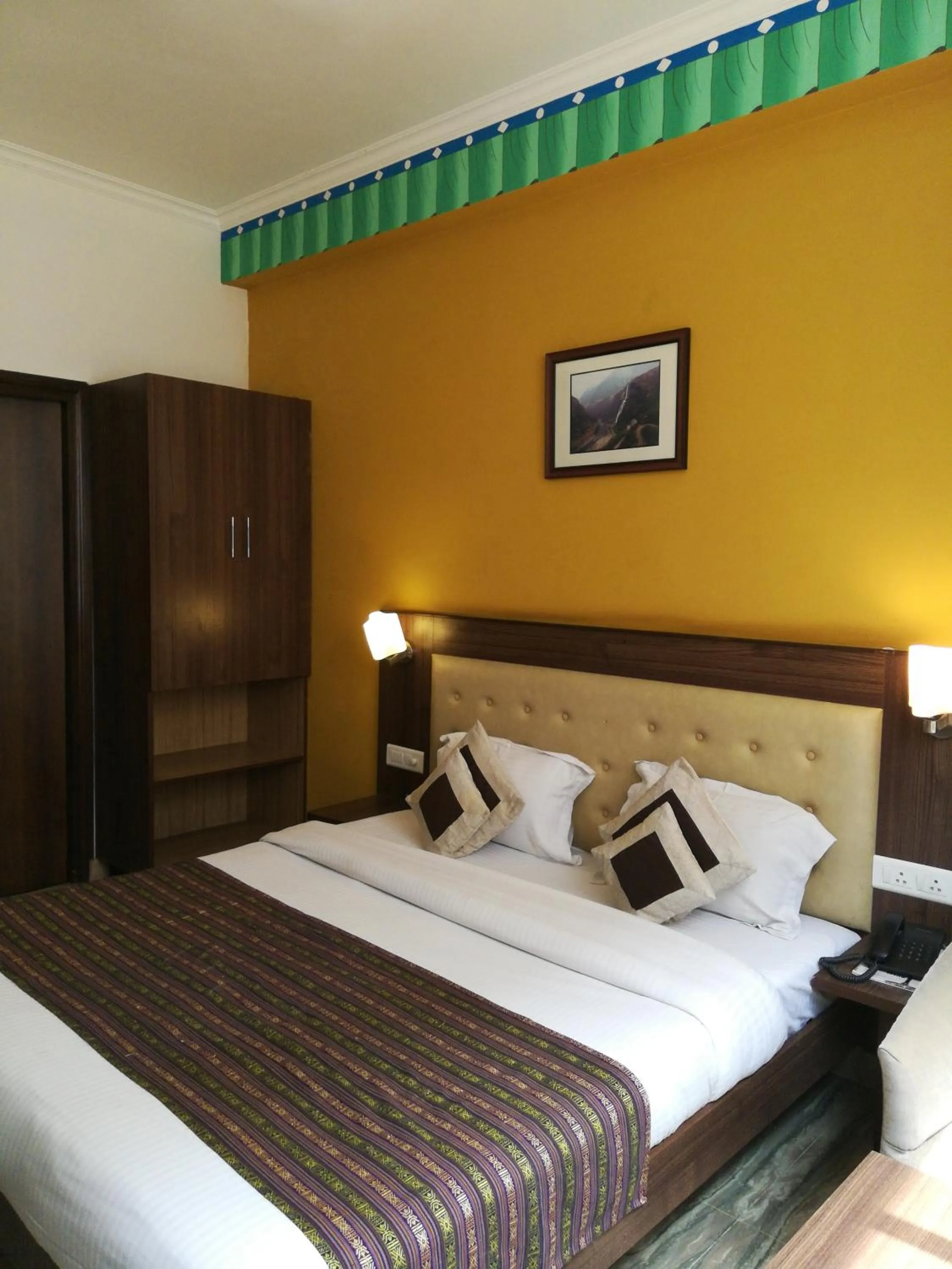 Bed in Inn Tawang Near B L Kapoor Hospital A Well Hygiene Hotel