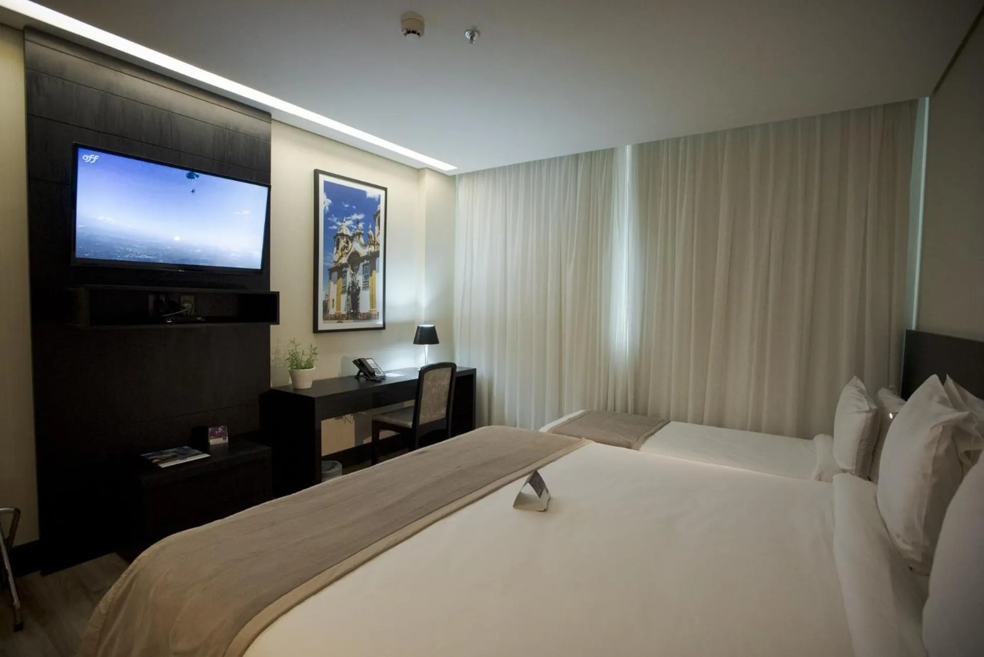 Bedroom, Bed in Cassino Tower Savassi - Próximo a FIEMG