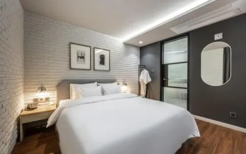 Bed in Brown Dot Hotel Sajik Baseball Stadium