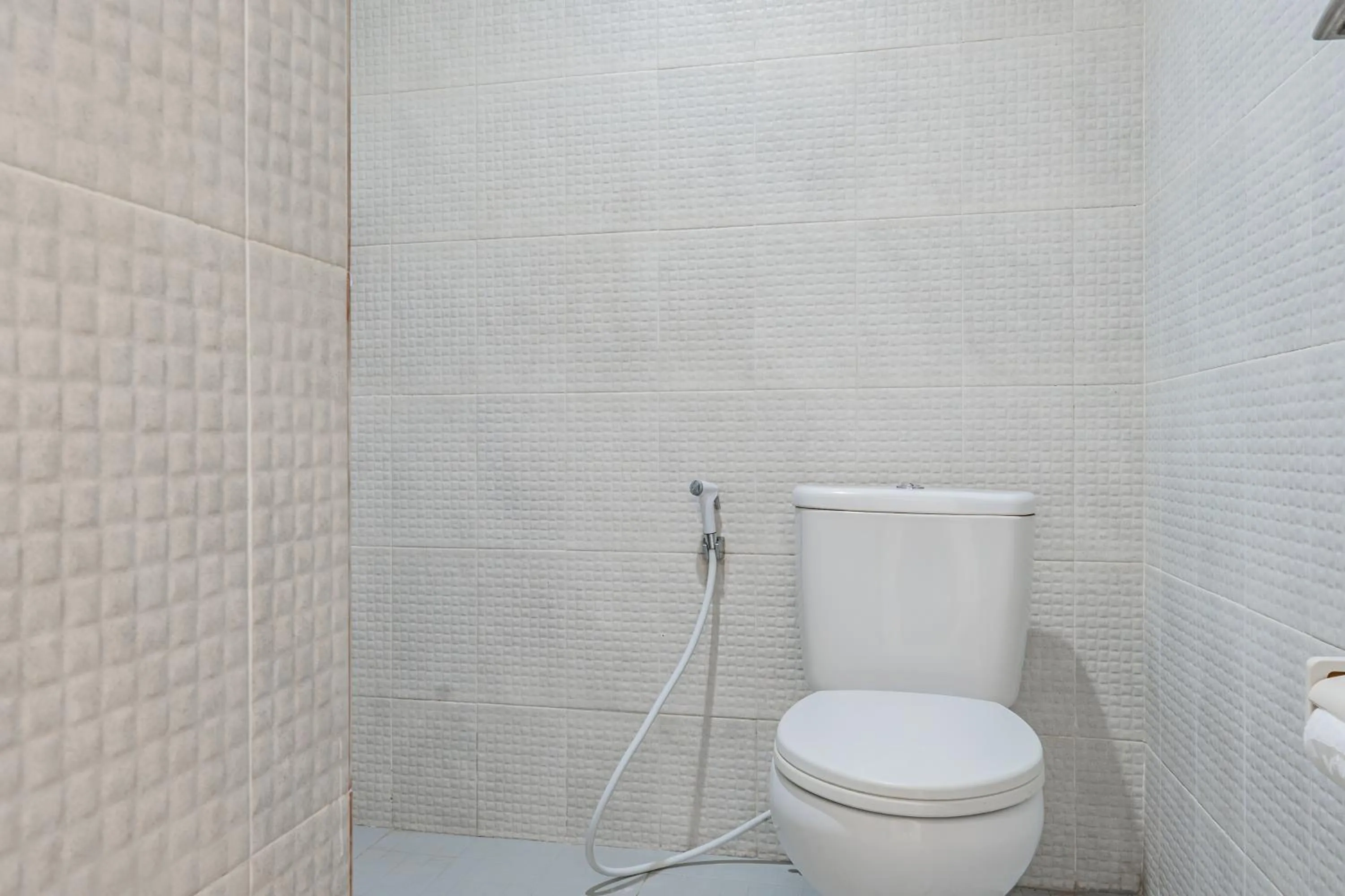 Bathroom in Collection O Kuta Near Airport Ngurah Rai