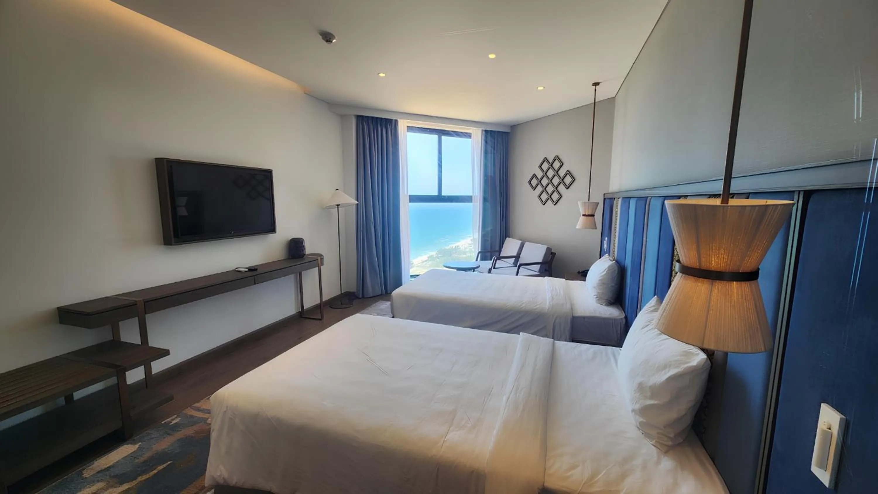 Communal lounge/ TV room, Bed in Apec Luxe Escape Sunset Resort