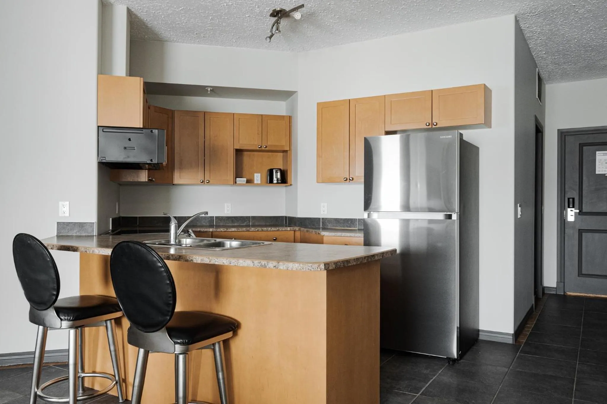 Kitchen or kitchenette in Premier Residence - Fort McMurray