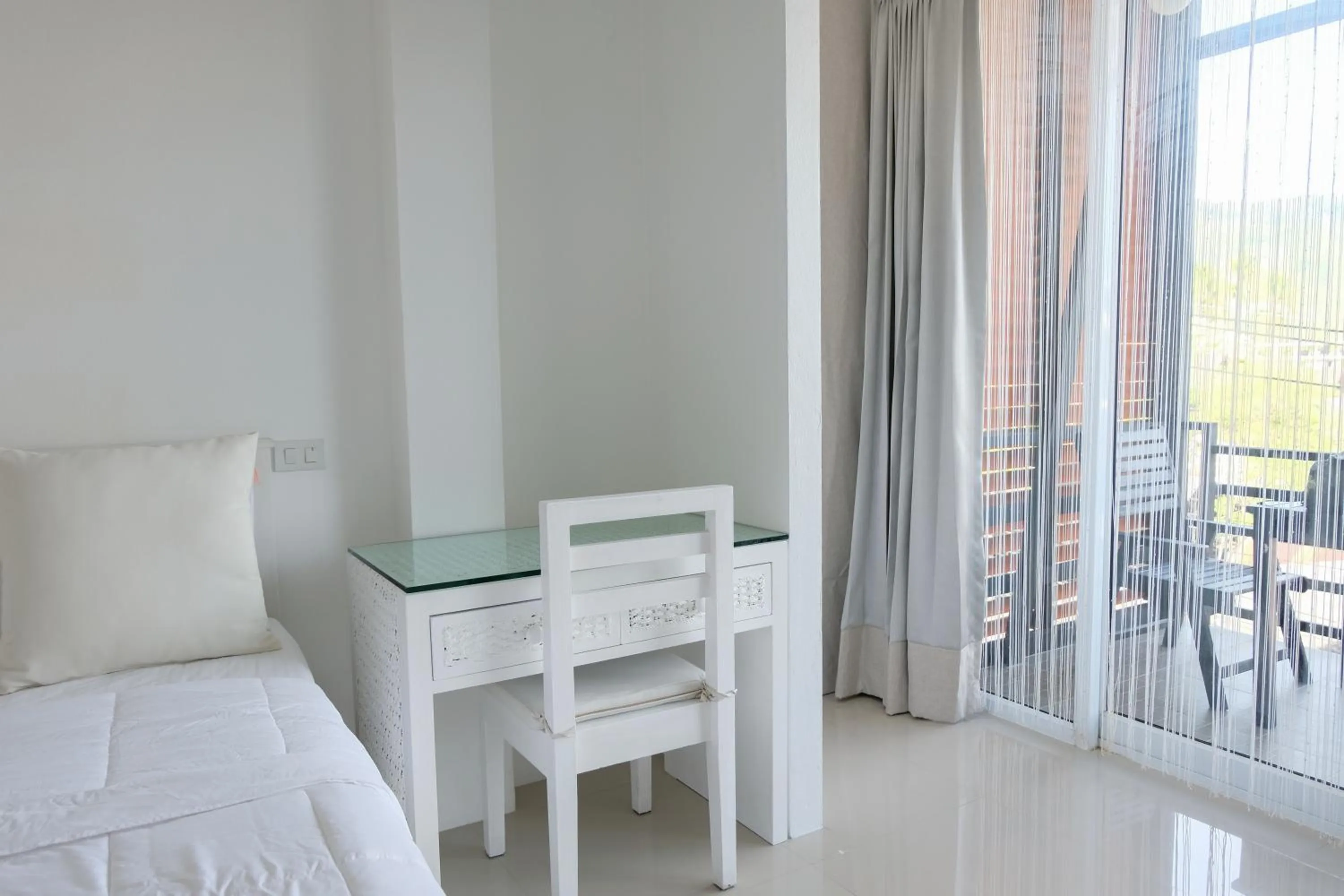 Seating area, Bed in Baanpoon Apartment