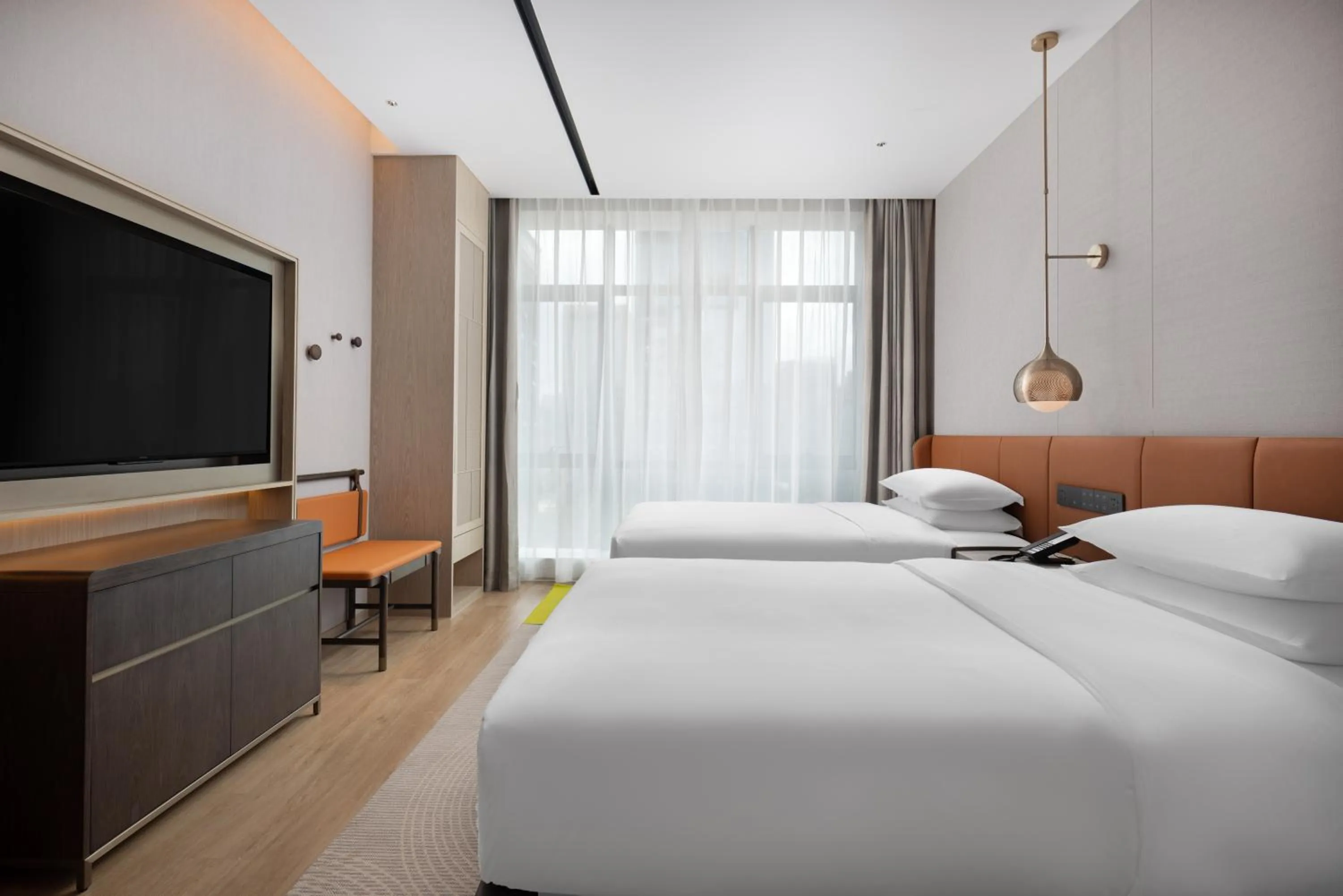 Communal lounge/ TV room, Bed in Home2 Suites by Hilton Guiyang Guanshanhu