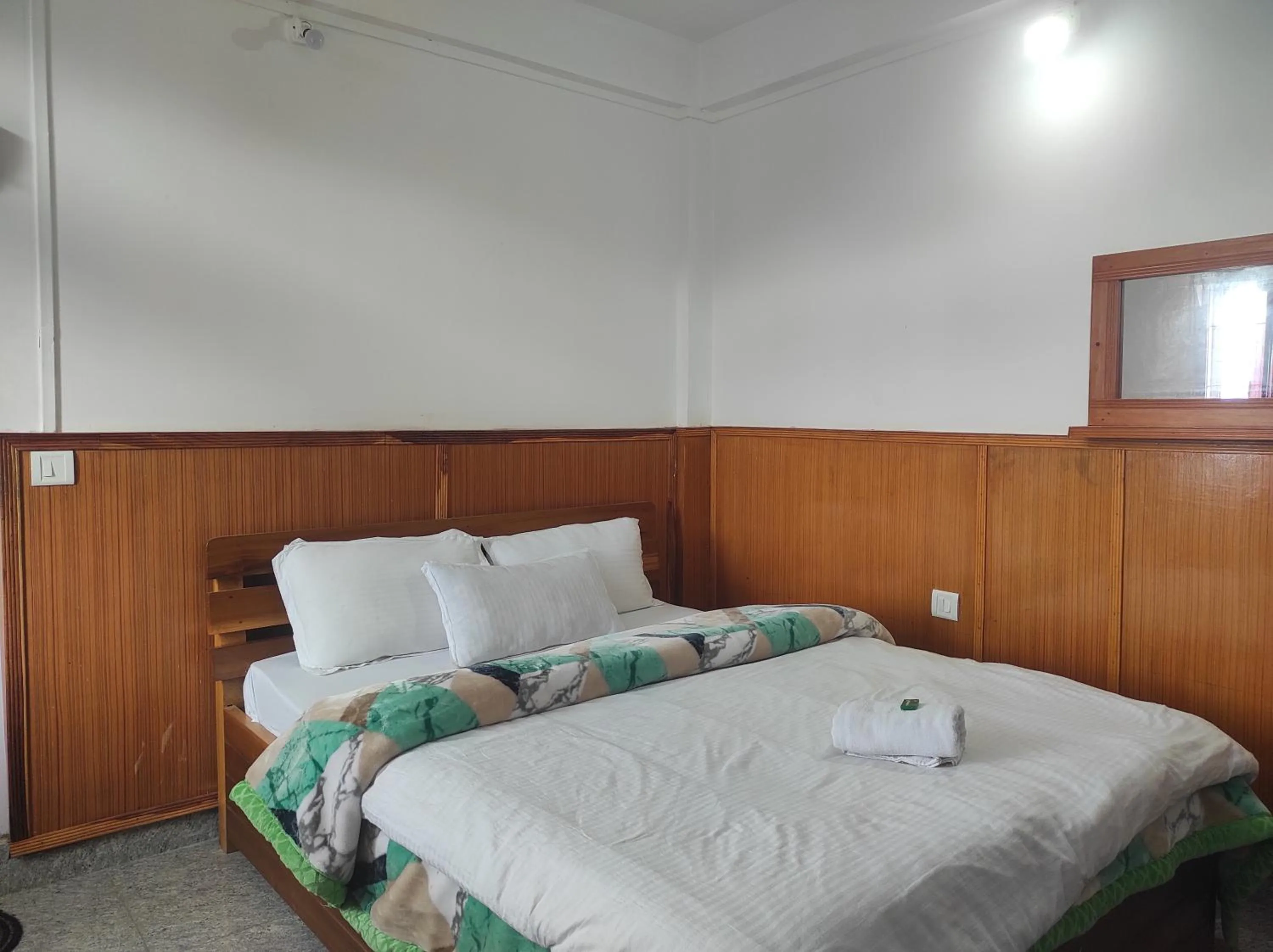 Bed in Hotel Tawang Regency