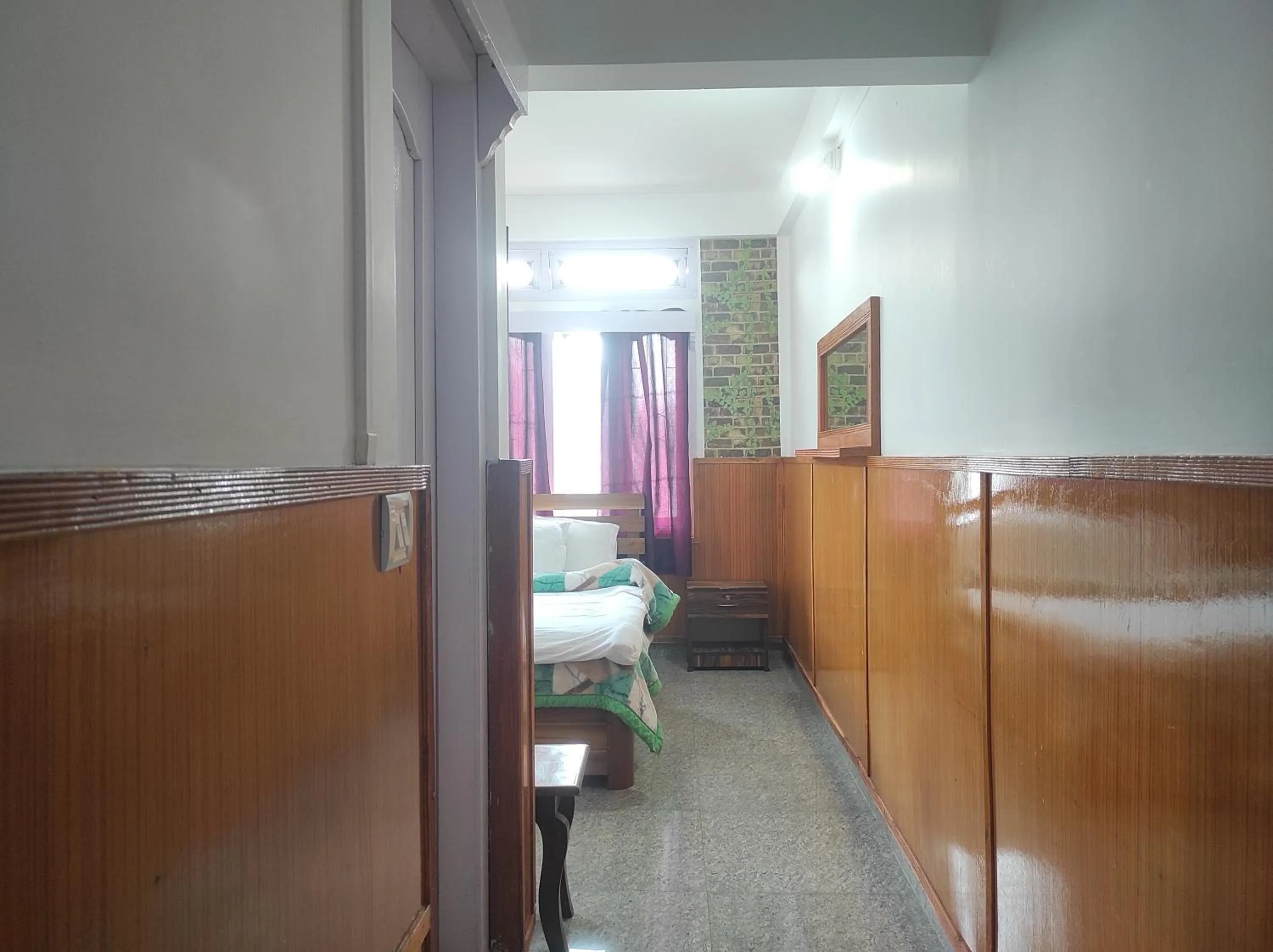 Bed in Hotel Tawang Regency