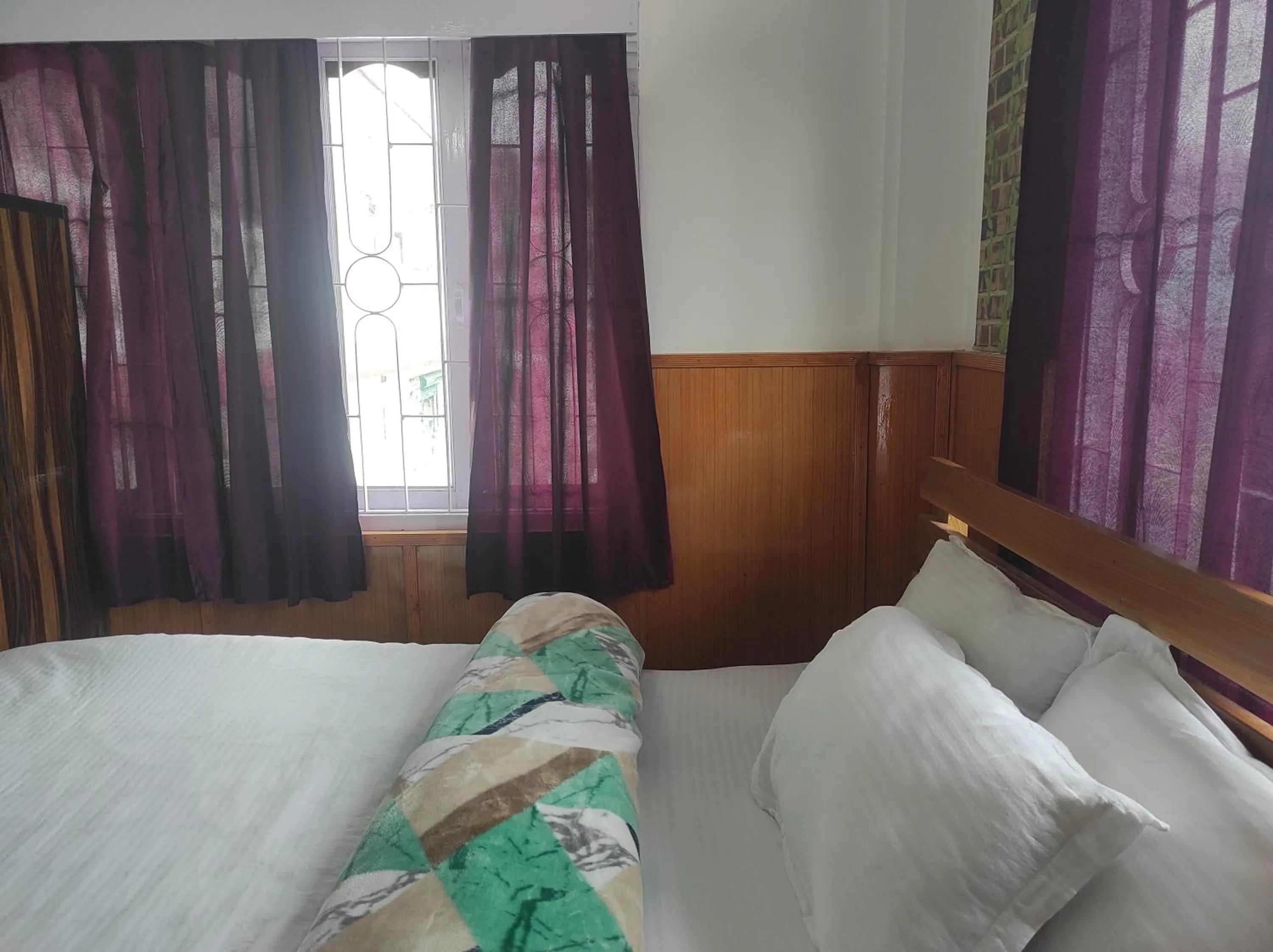 Bed in Hotel Tawang Regency