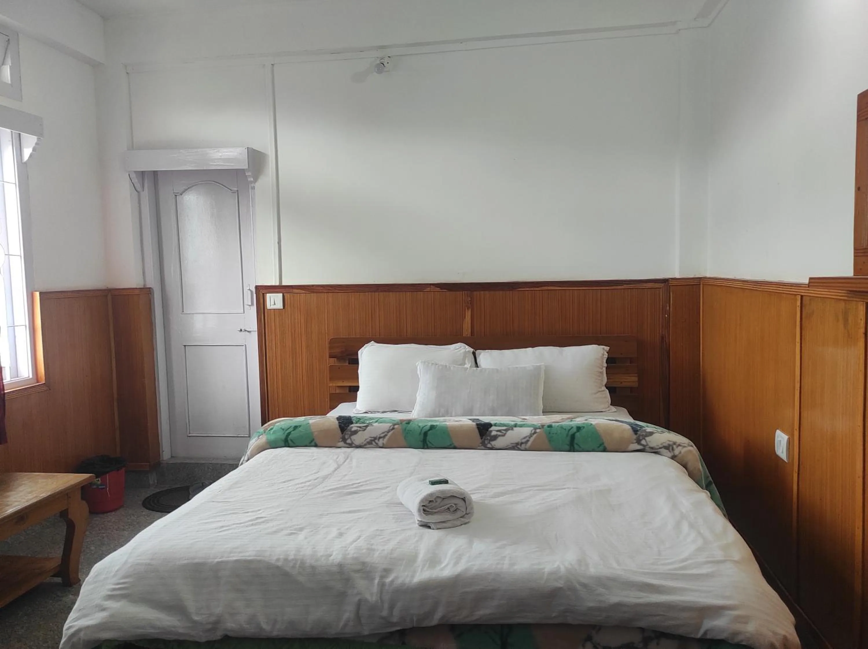Bed in Hotel Tawang Regency