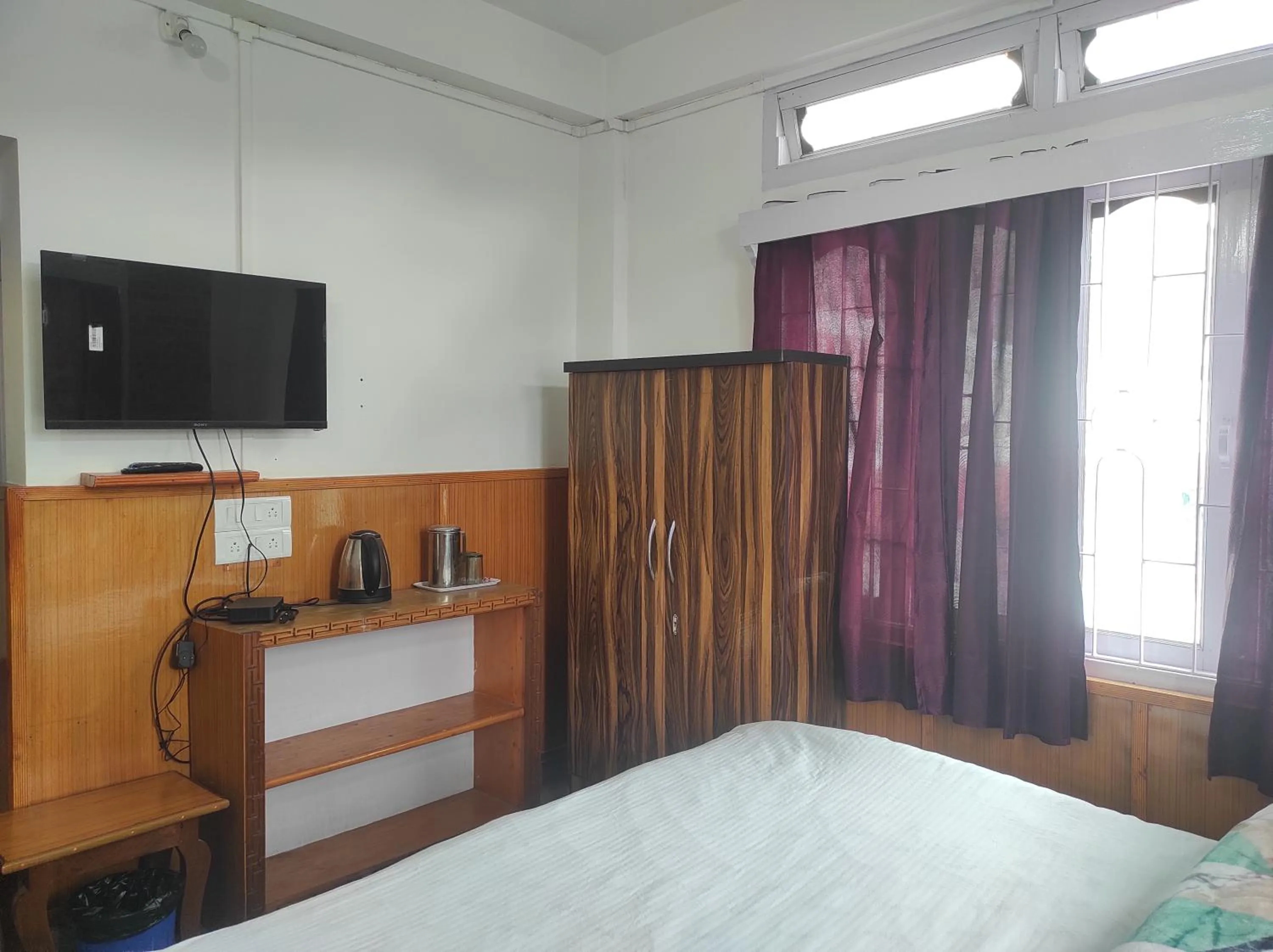 Bed in Hotel Tawang Regency