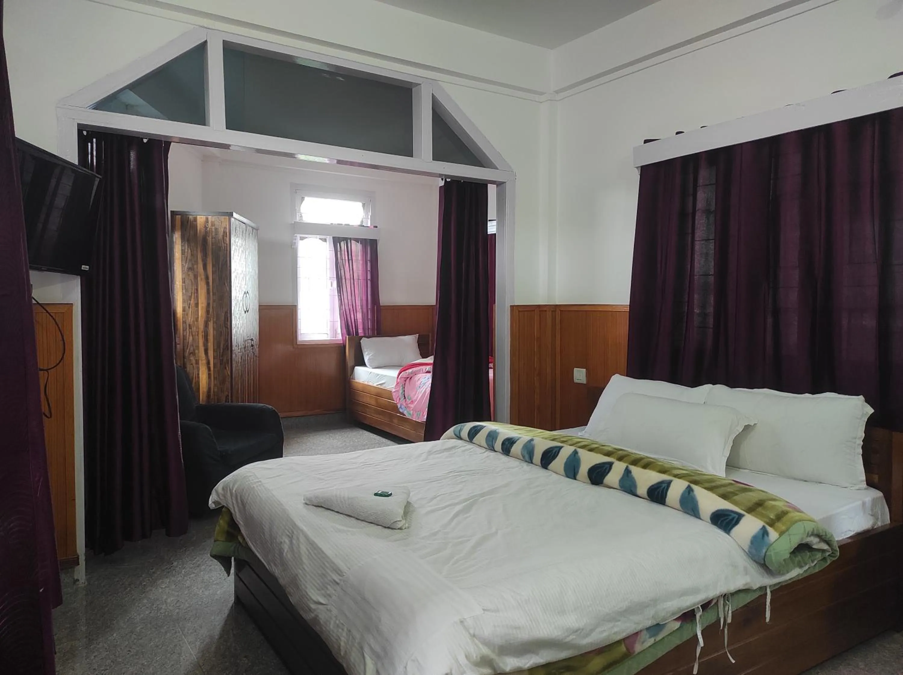 Bed in Hotel Tawang Regency