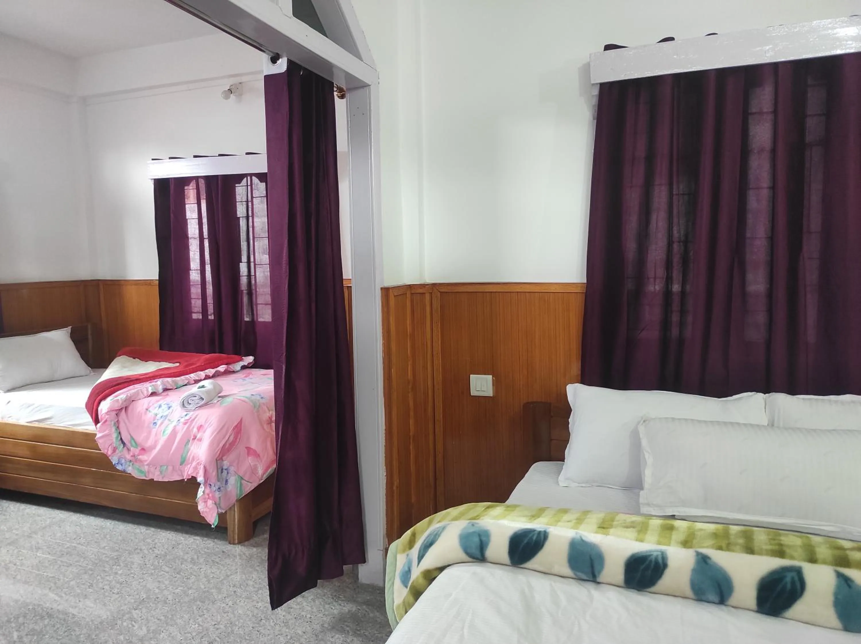 Bed in Hotel Tawang Regency