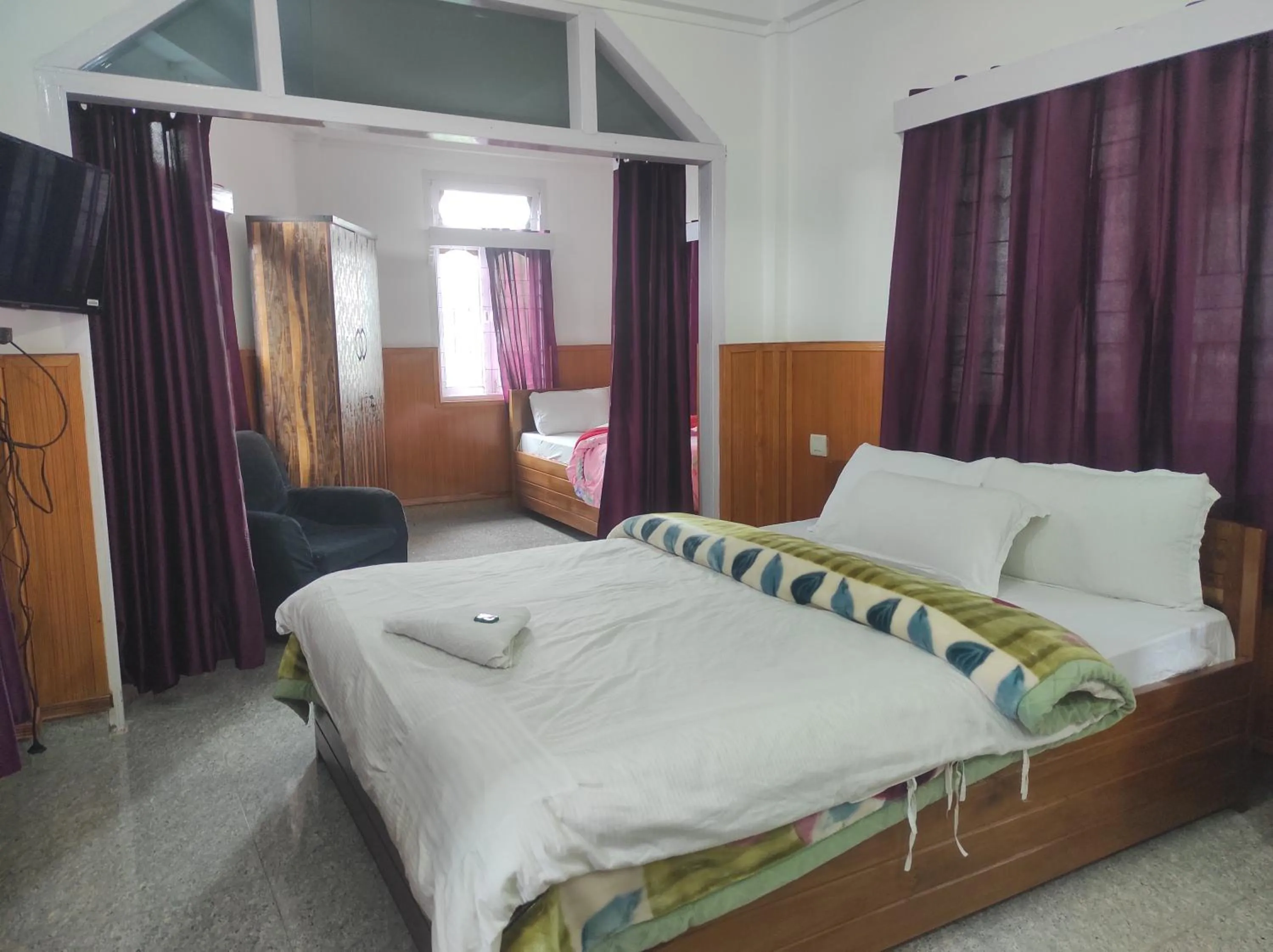 Bed in Hotel Tawang Regency