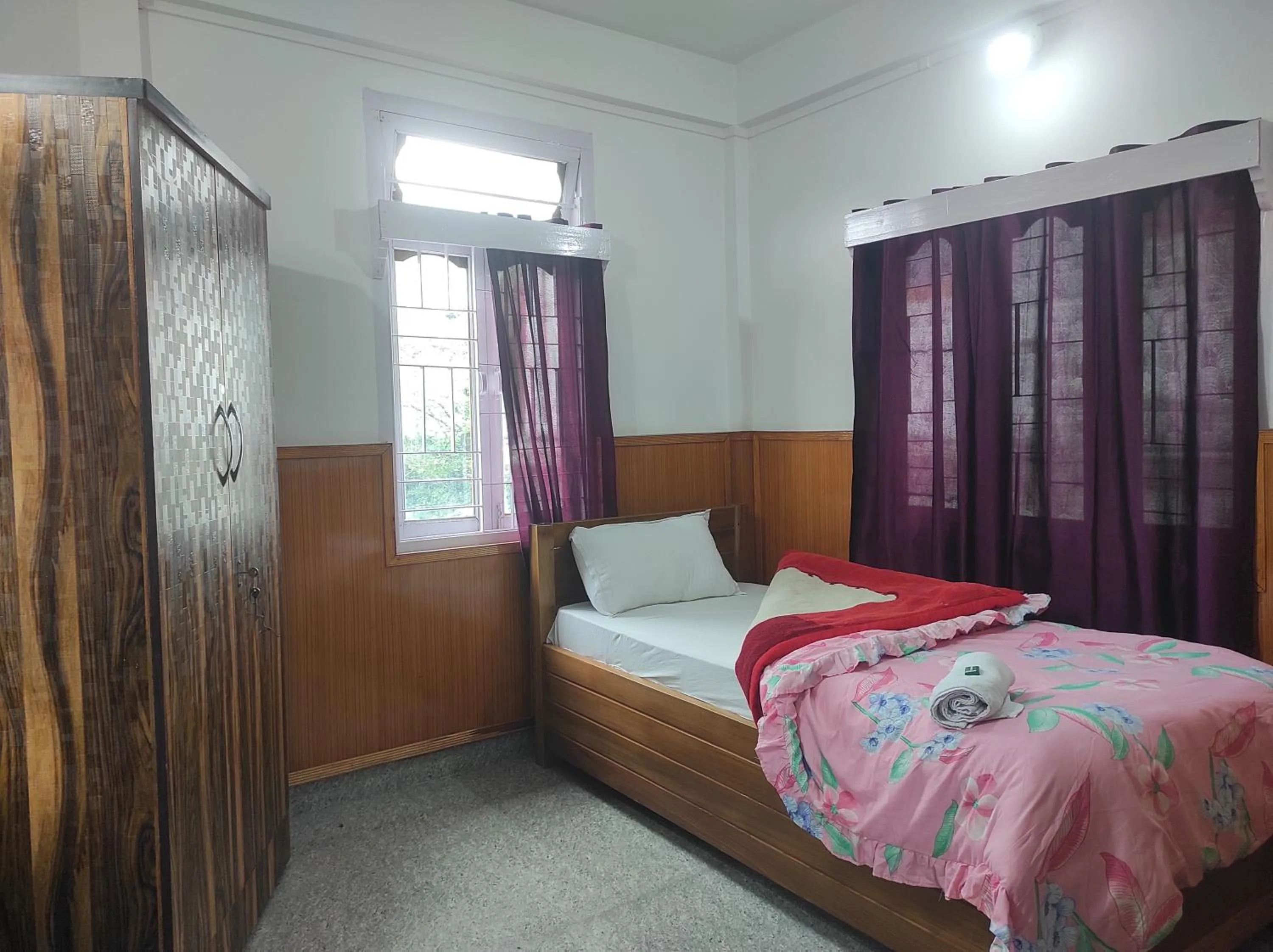 Bed in Hotel Tawang Regency