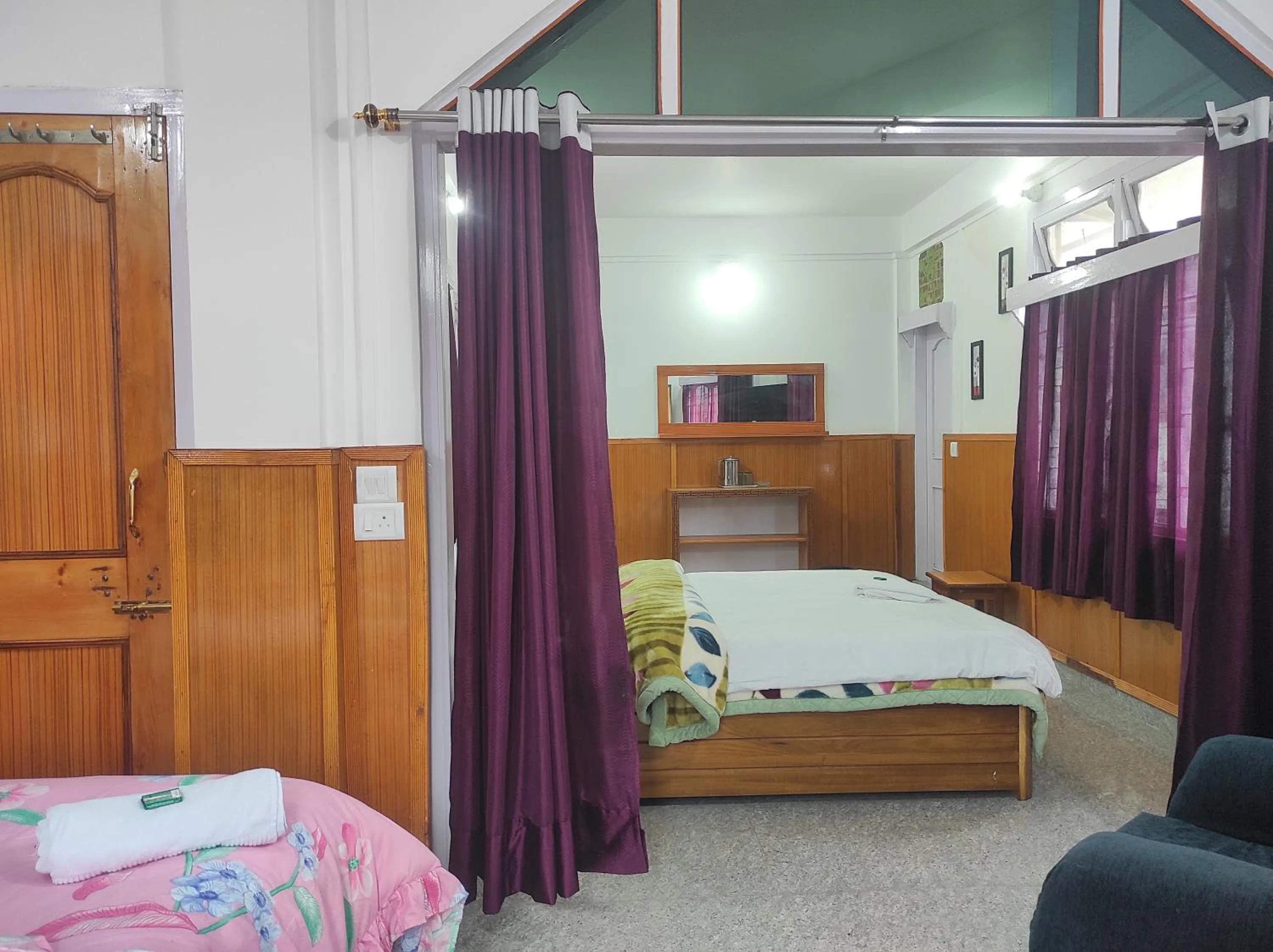 Bed in Hotel Tawang Regency