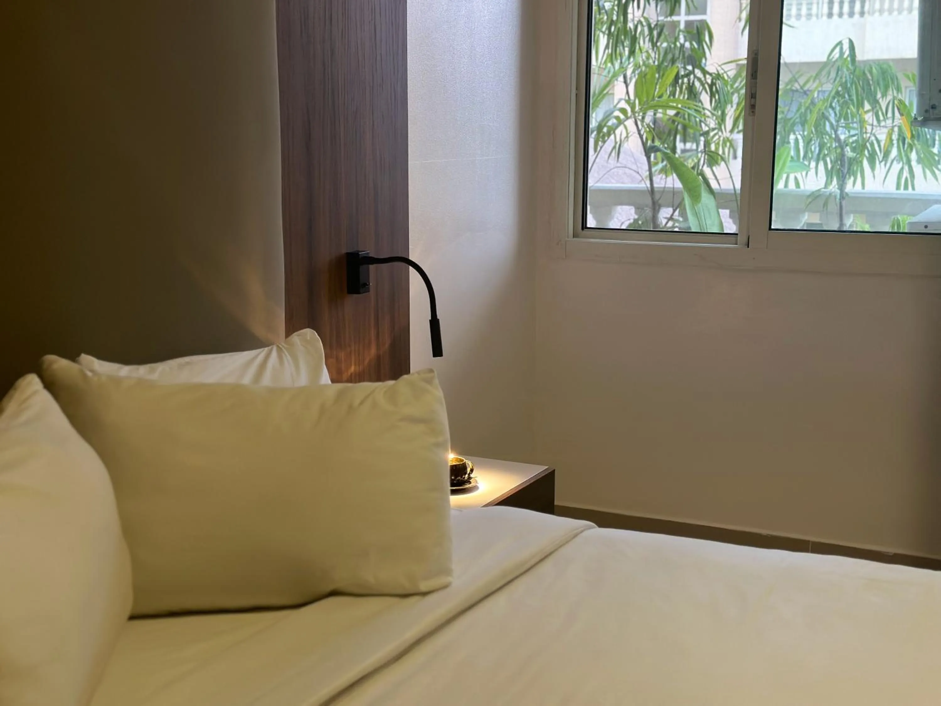 Bed in Guided Hospitality - Luxury Accommodations