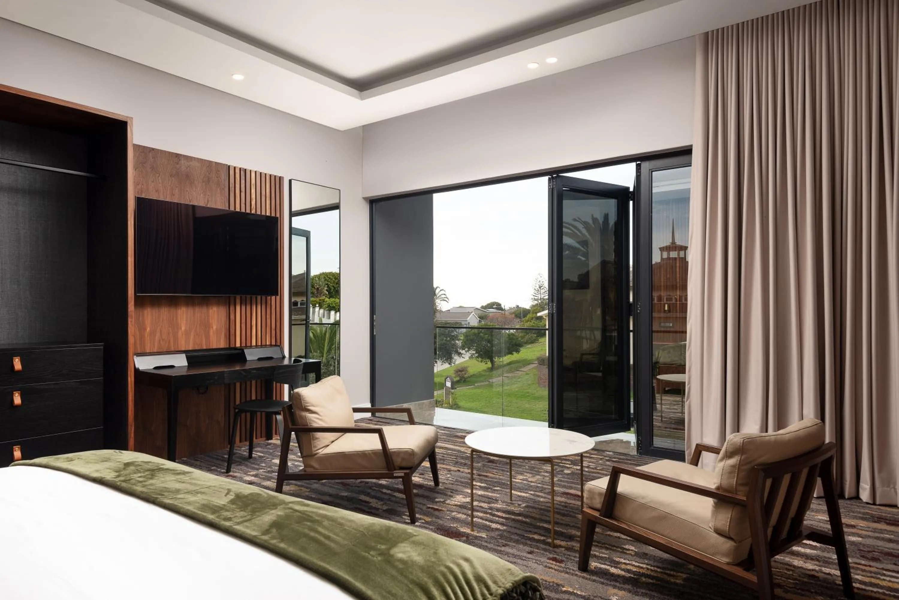 Communal lounge/ TV room in Anfani Boutique Hotel