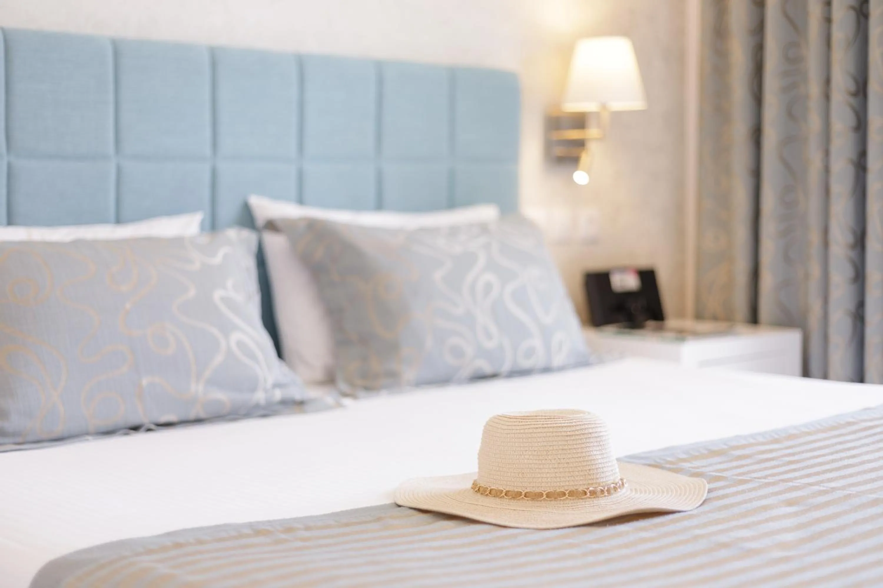 Bed in Melina Bay Boutique Hotel