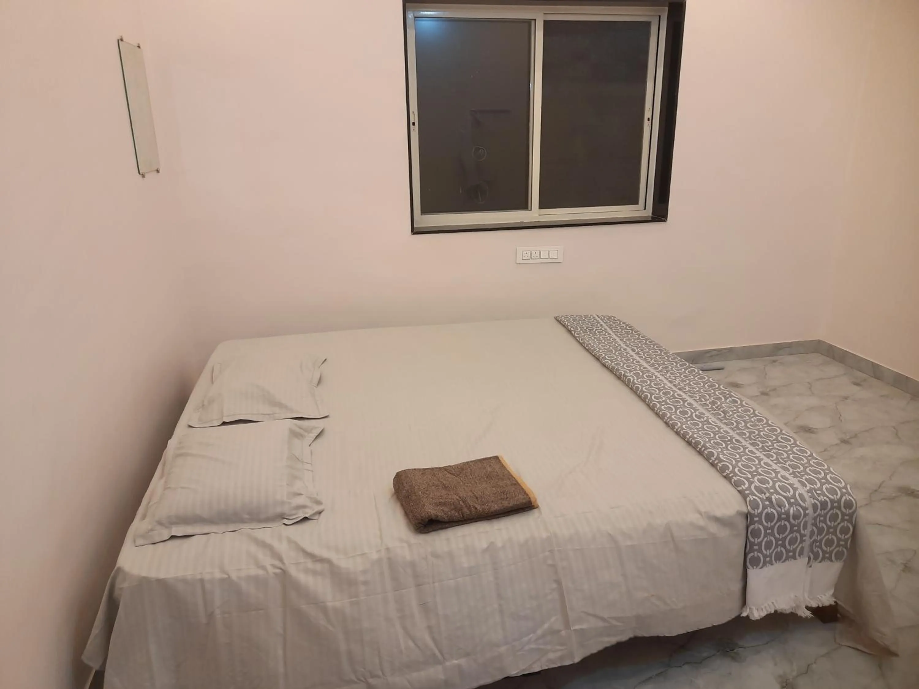 Bed in Shriguru Guest House Akkalkot