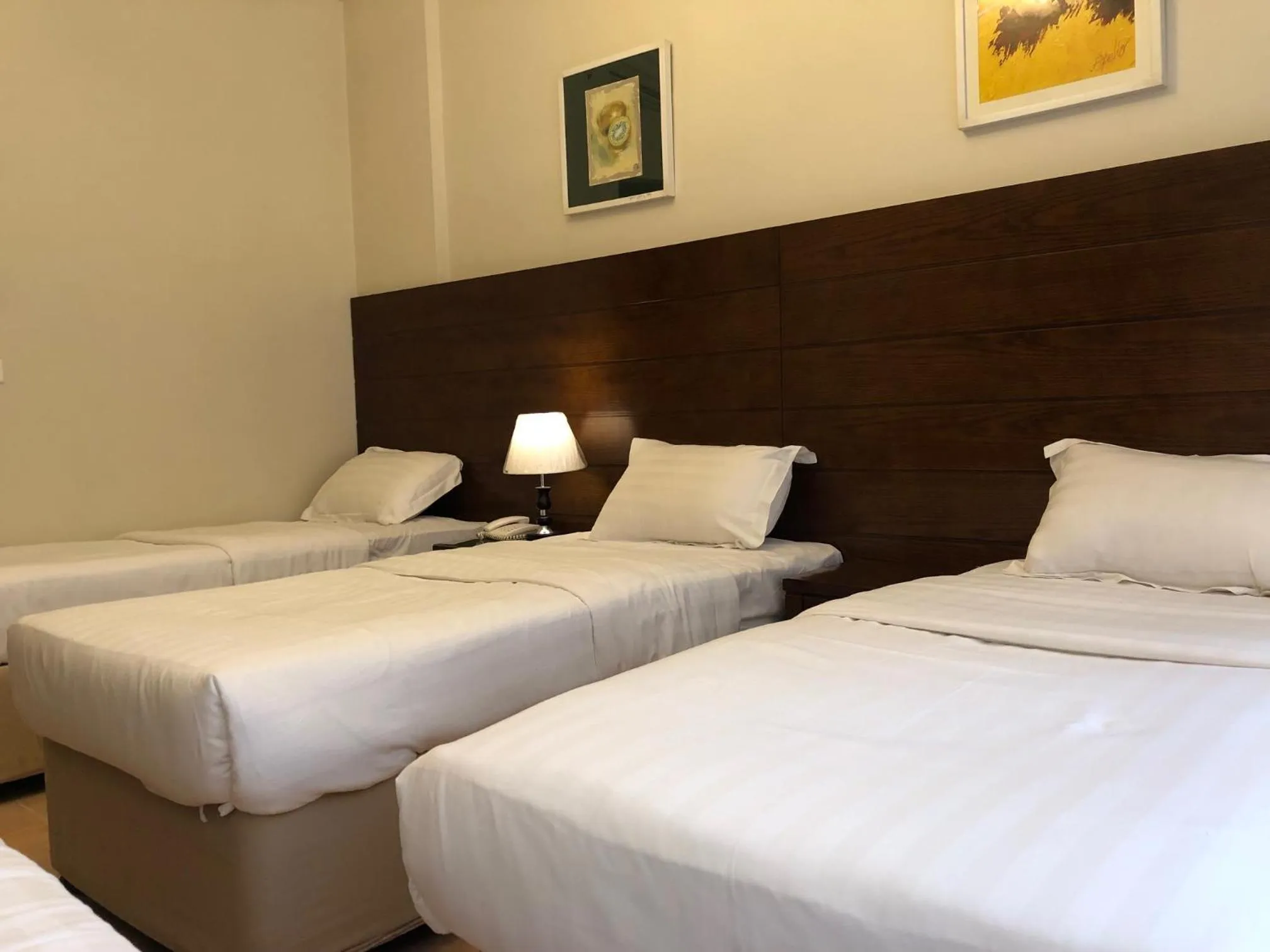 Bed in Manazel Alaswaf Hotel