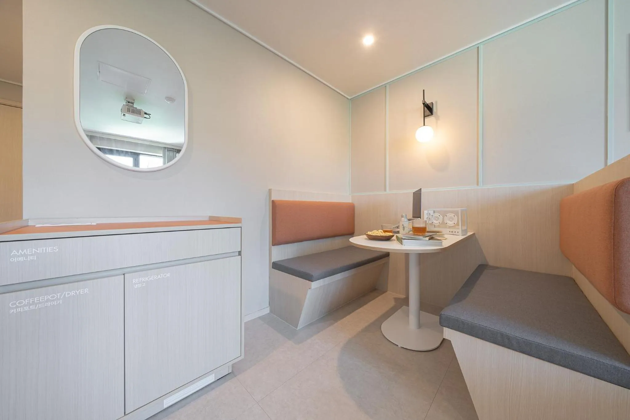 Seating area in Workers Hotel Ansan by Aank