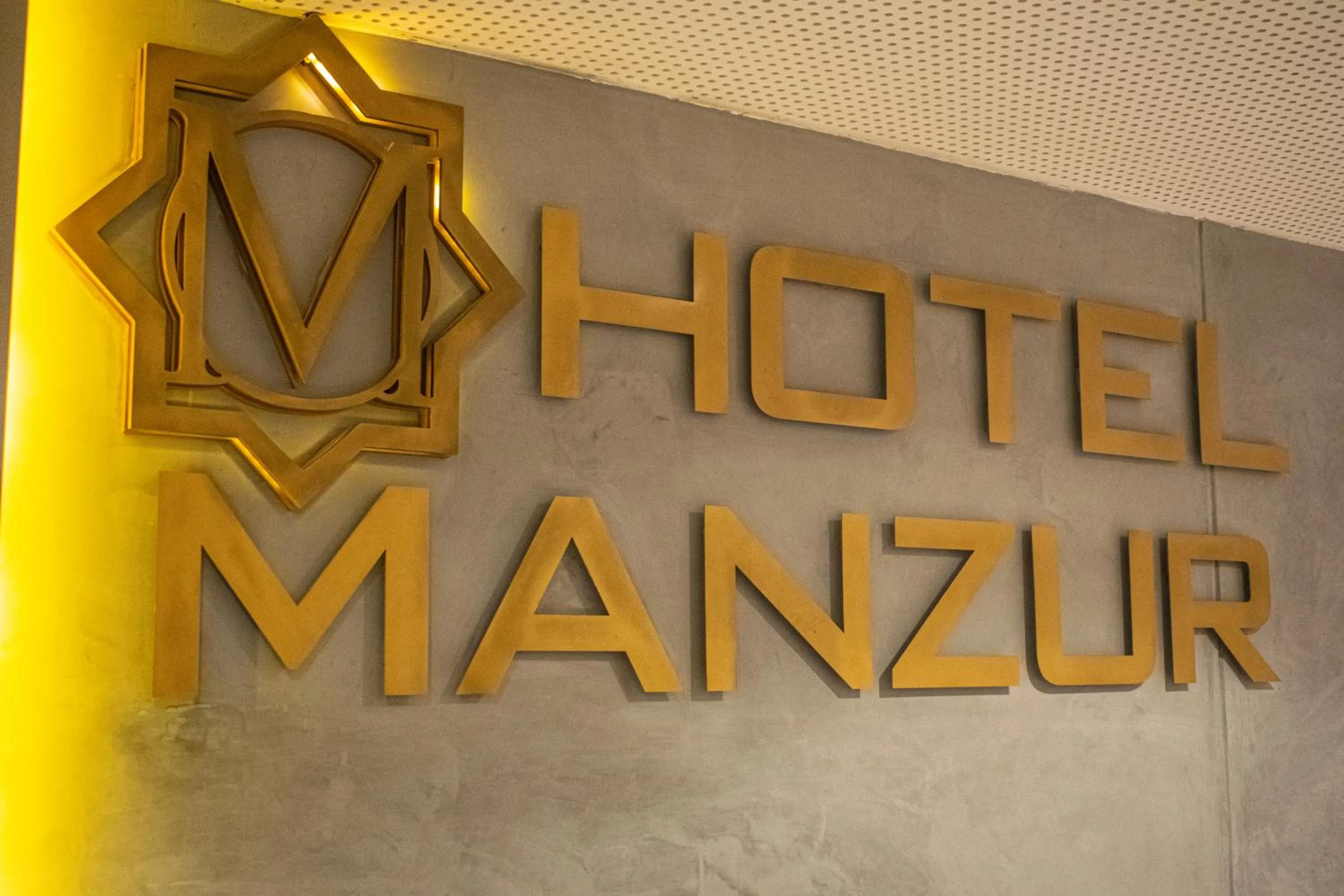 Property logo or sign in HOTEL MANZUR