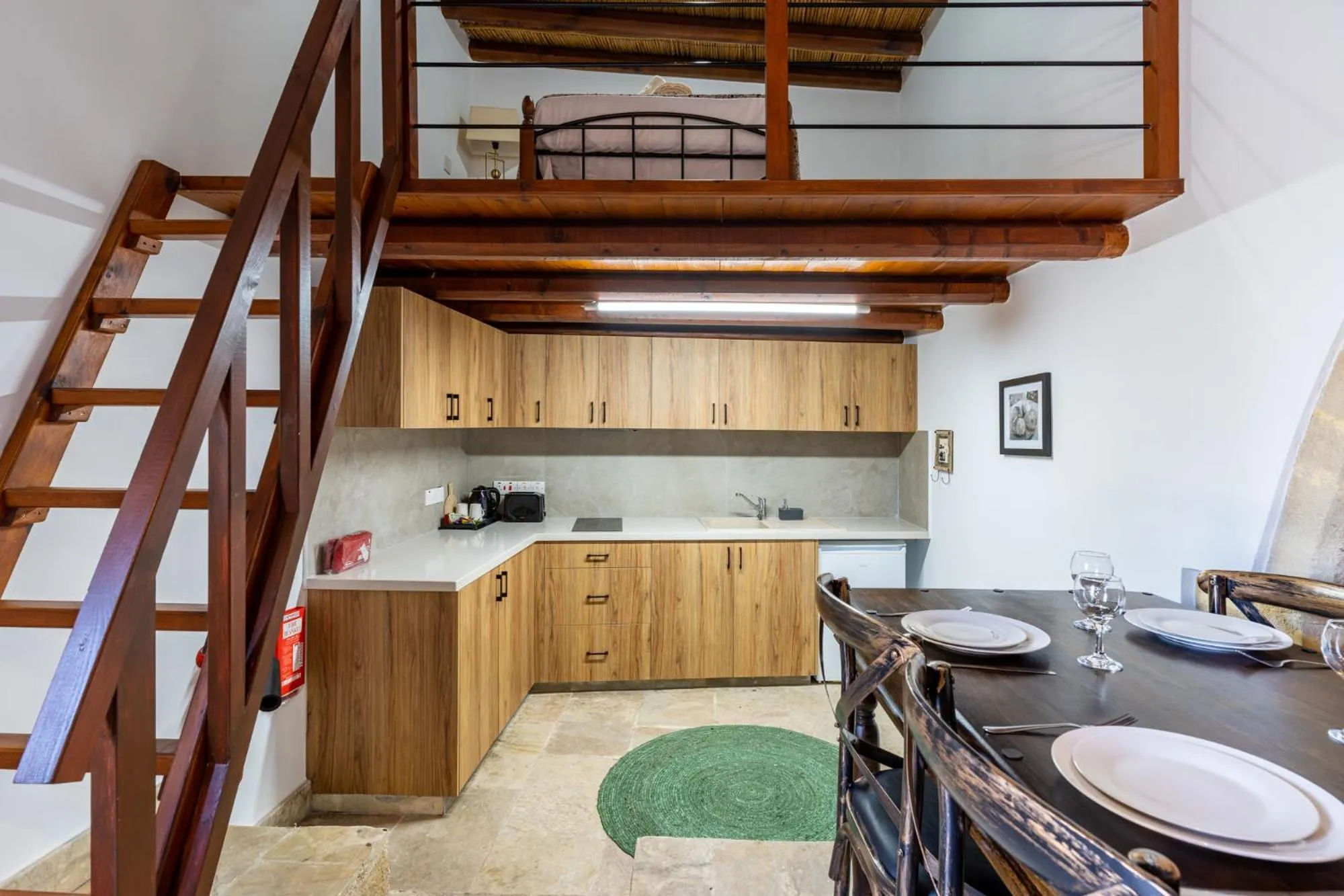 Kitchen or kitchenette in Stone Court Boutique Studios