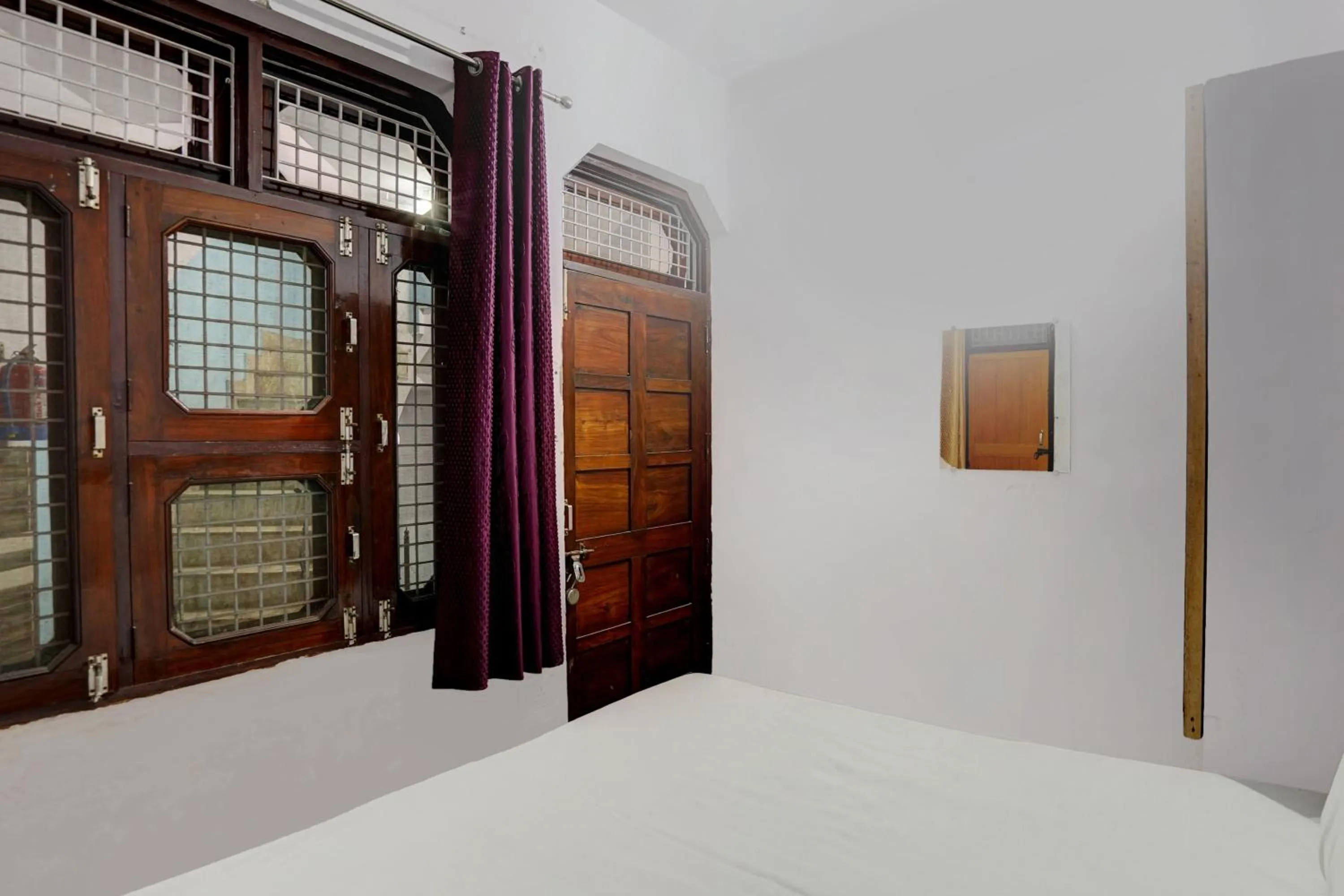 Bedroom in Hotel O The Honirav Hotel