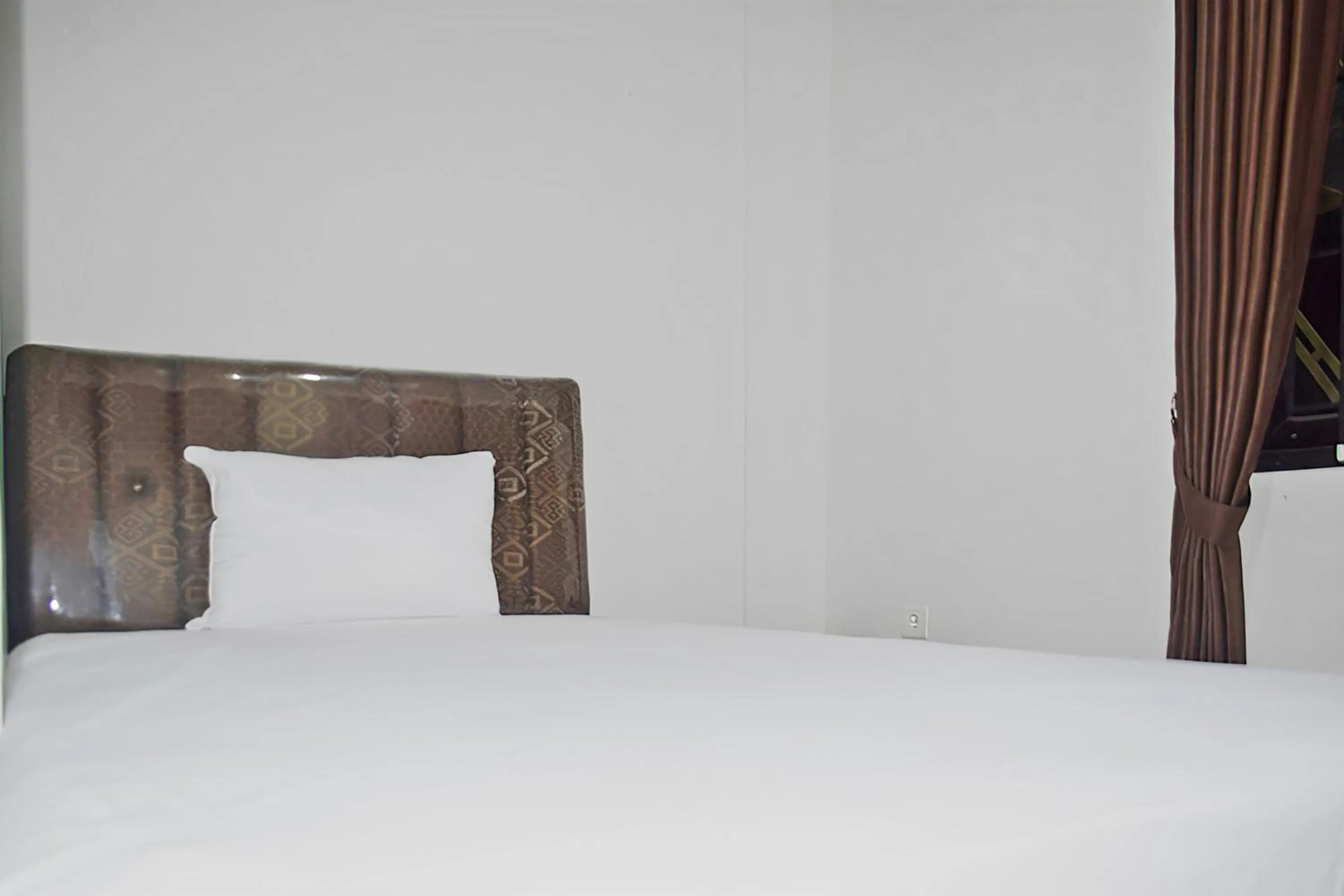 Bedroom in Super OYO 93085 Homy Stay Syariah