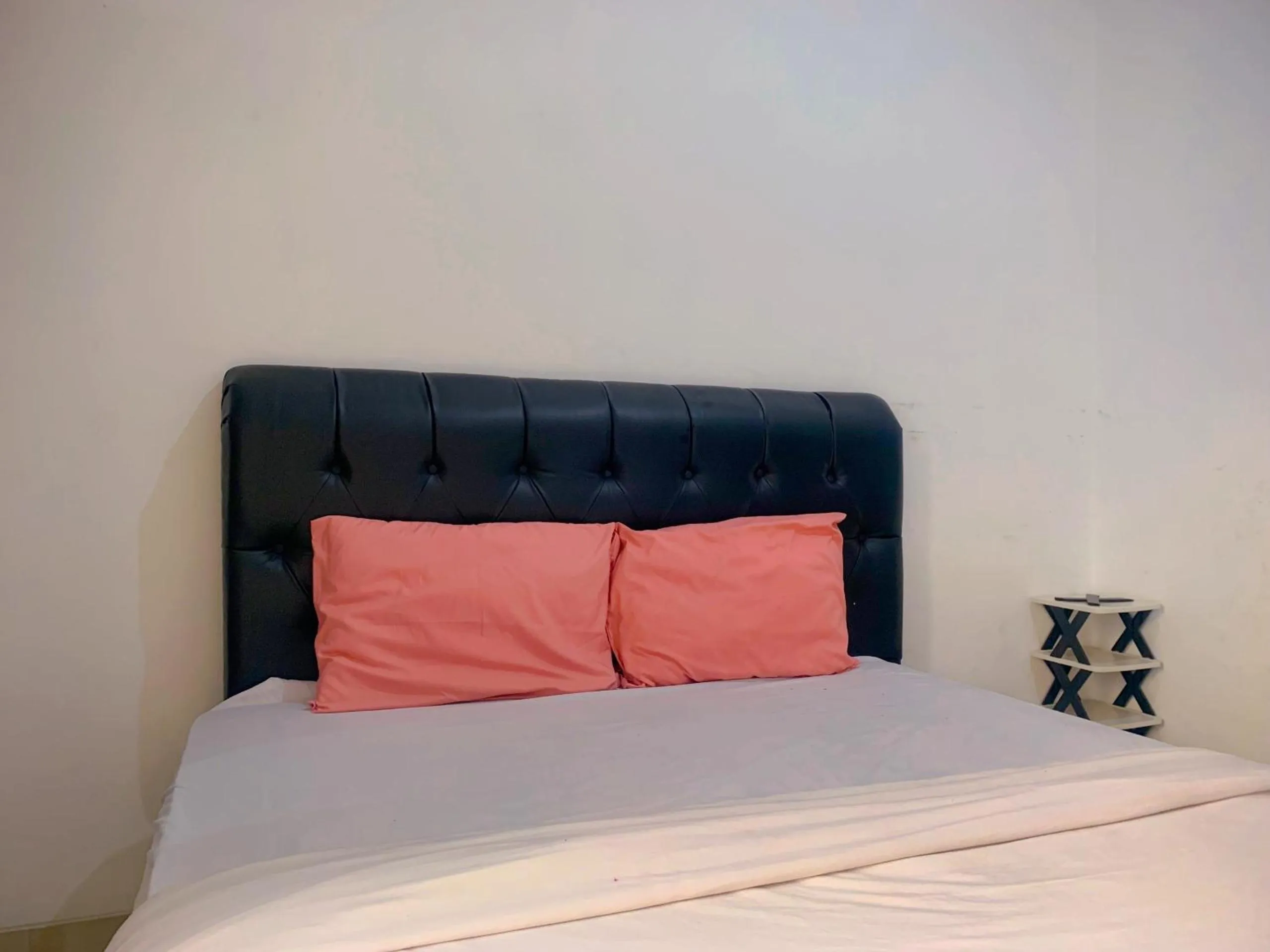 Bedroom in Apartemen Poris 88 by Benchmark