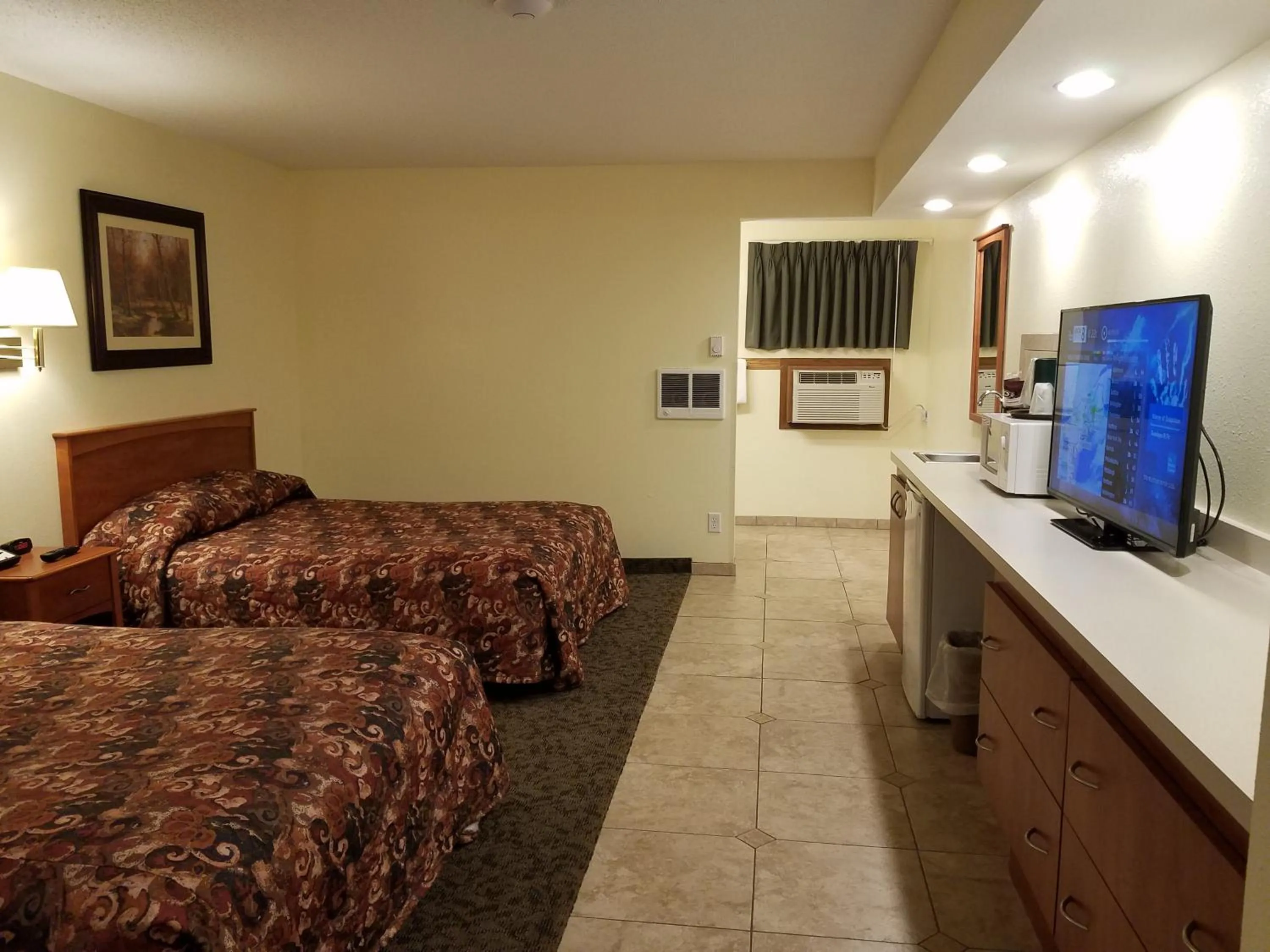 Bed in Black Hawk Motel & Suites