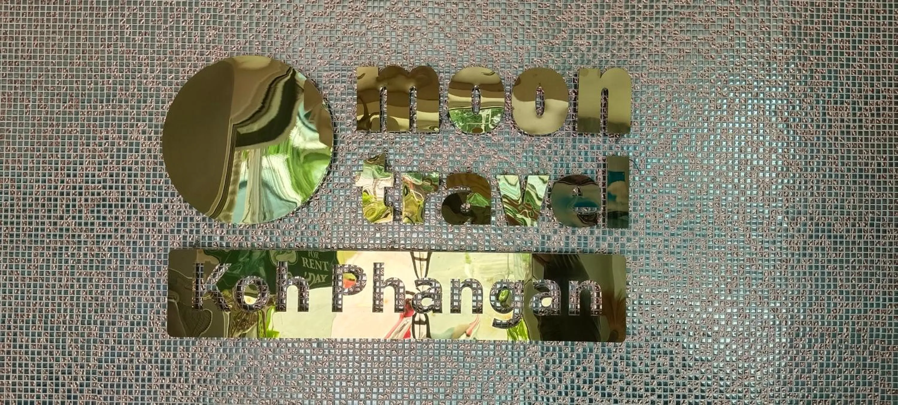 Property logo or sign in Moon Travel Phangan