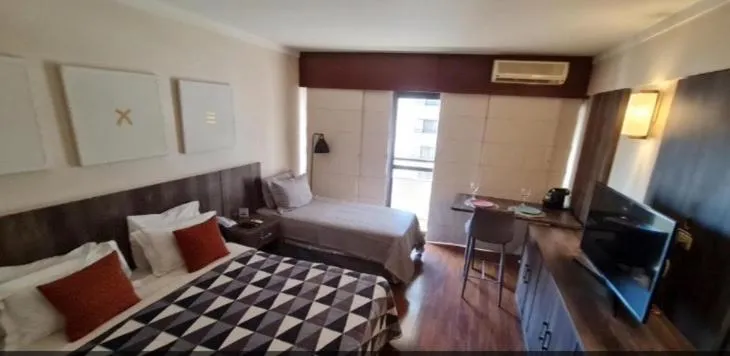 Bed in Grand Plaza Paulista Hotel