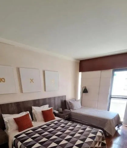 Bed in Grand Plaza Paulista Hotel