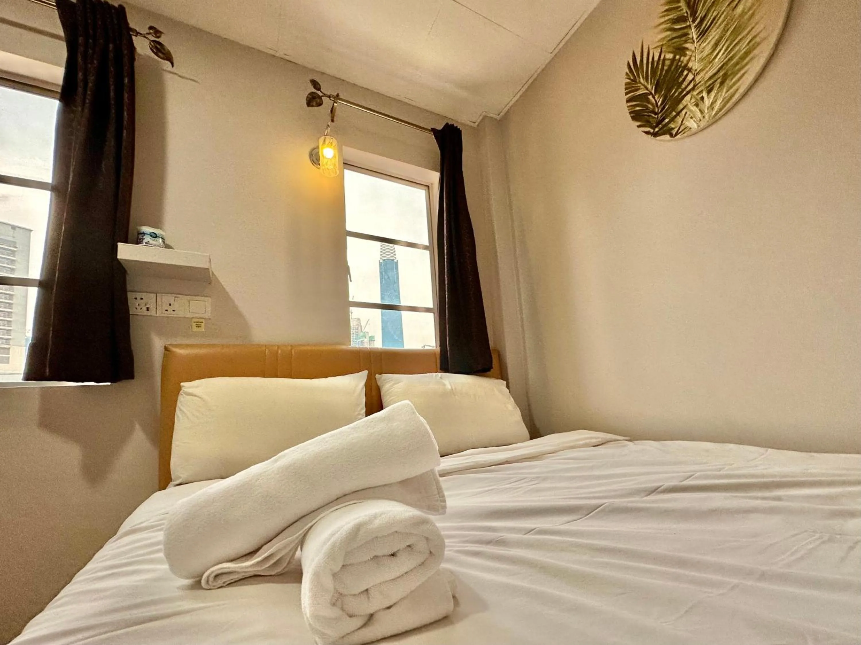 Bed in Dingdong Homes Hotel