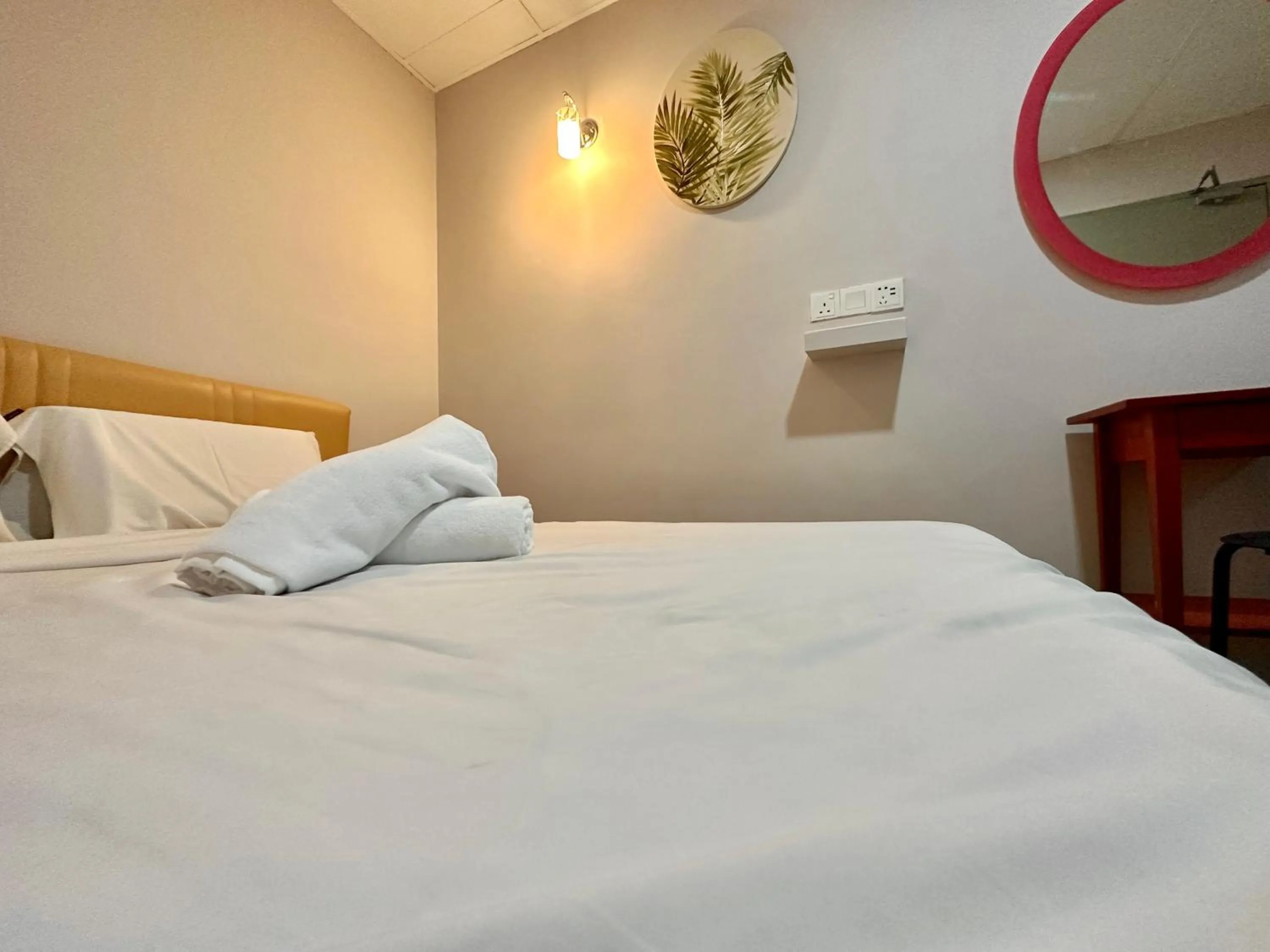 Bed in Dingdong Homes Hotel