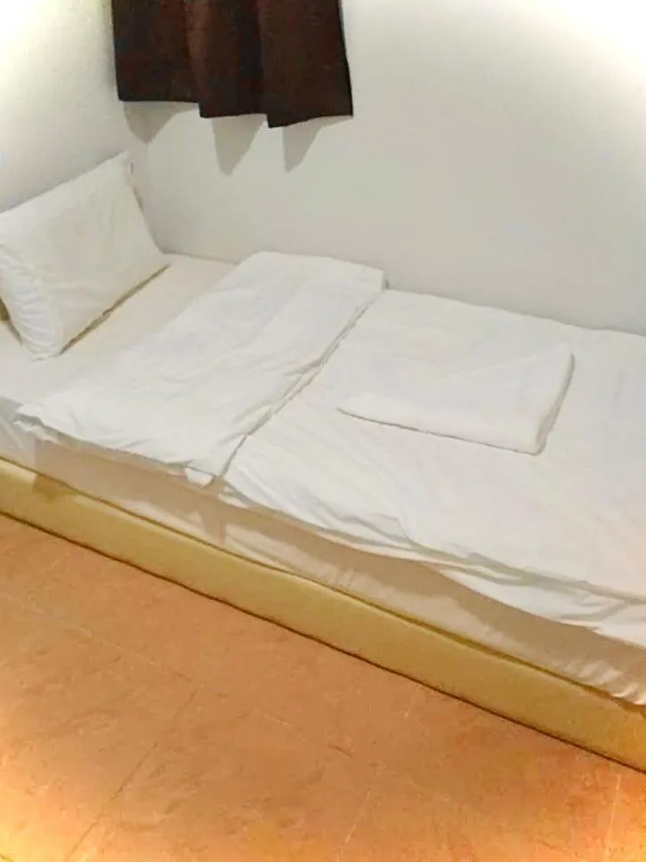Bed in Dingdong Homes Hotel