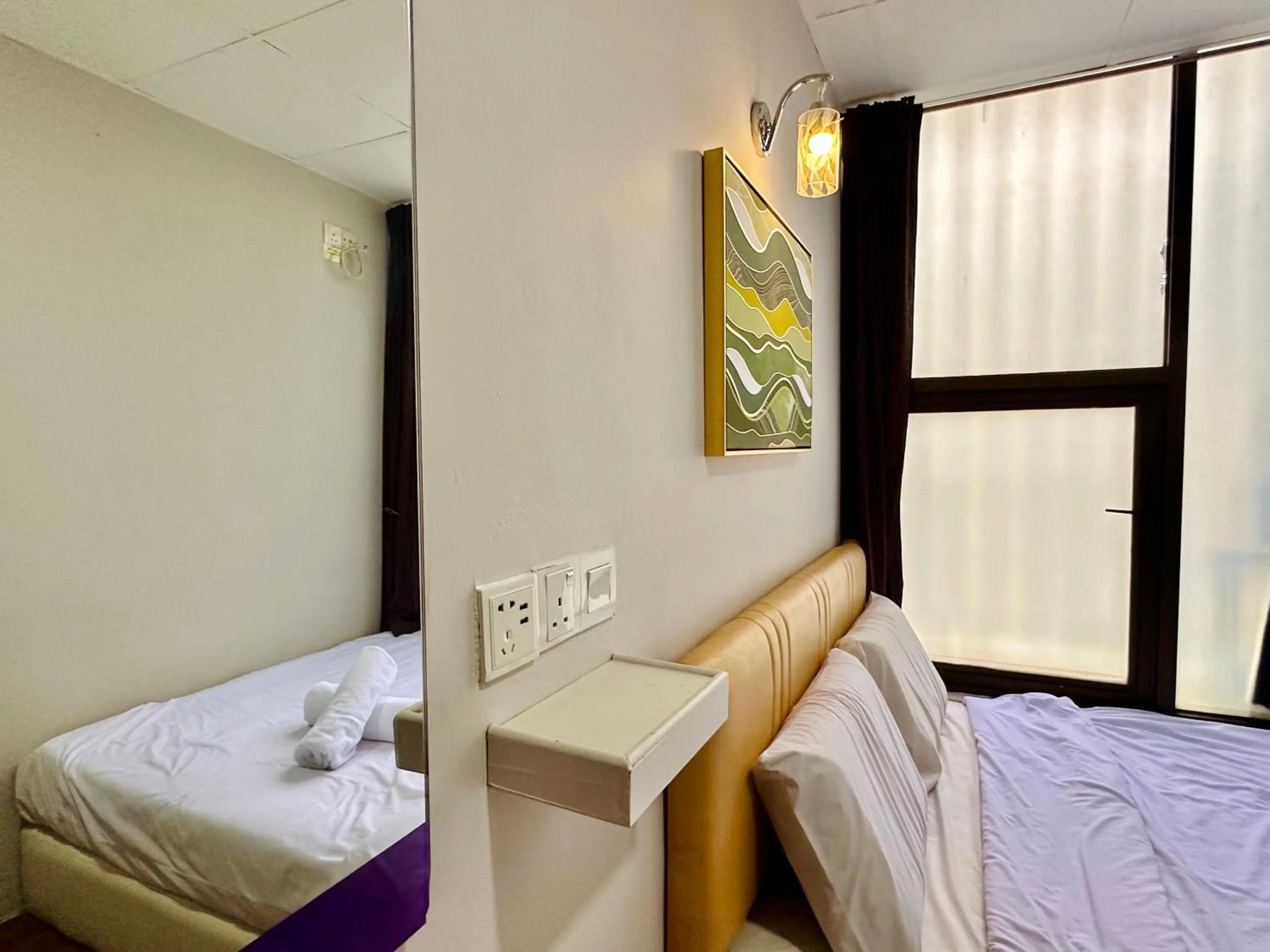 Bed in Dingdong Homes Hotel