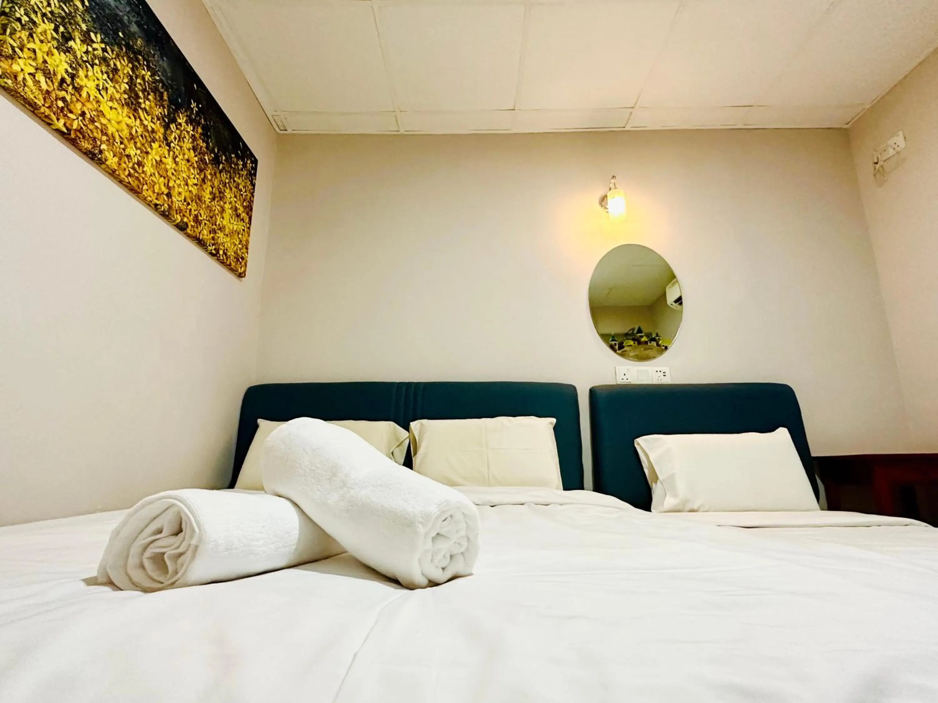 Bed in Dingdong Homes Hotel