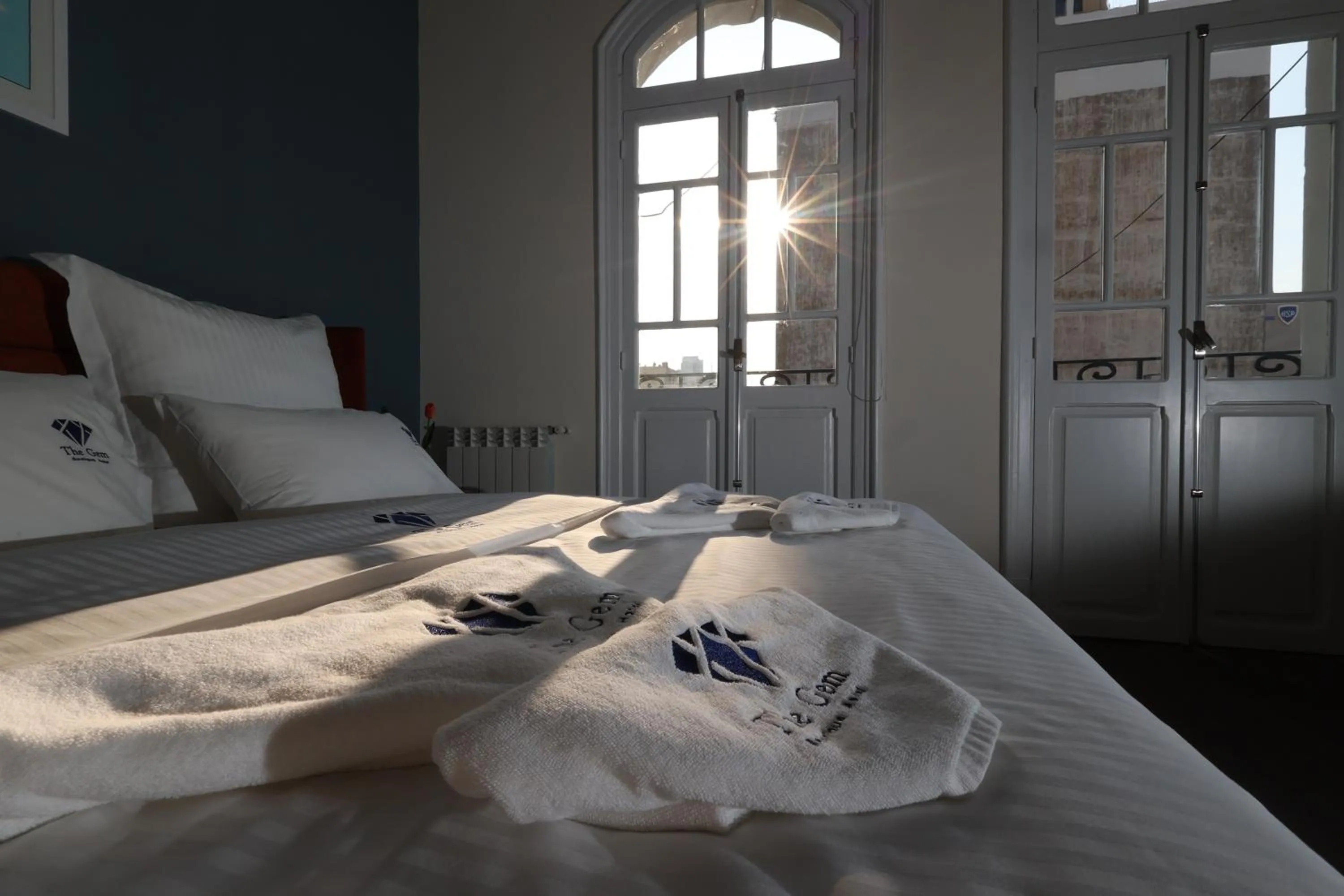 Bed in THE GEM BOUTIQUE HOTEL