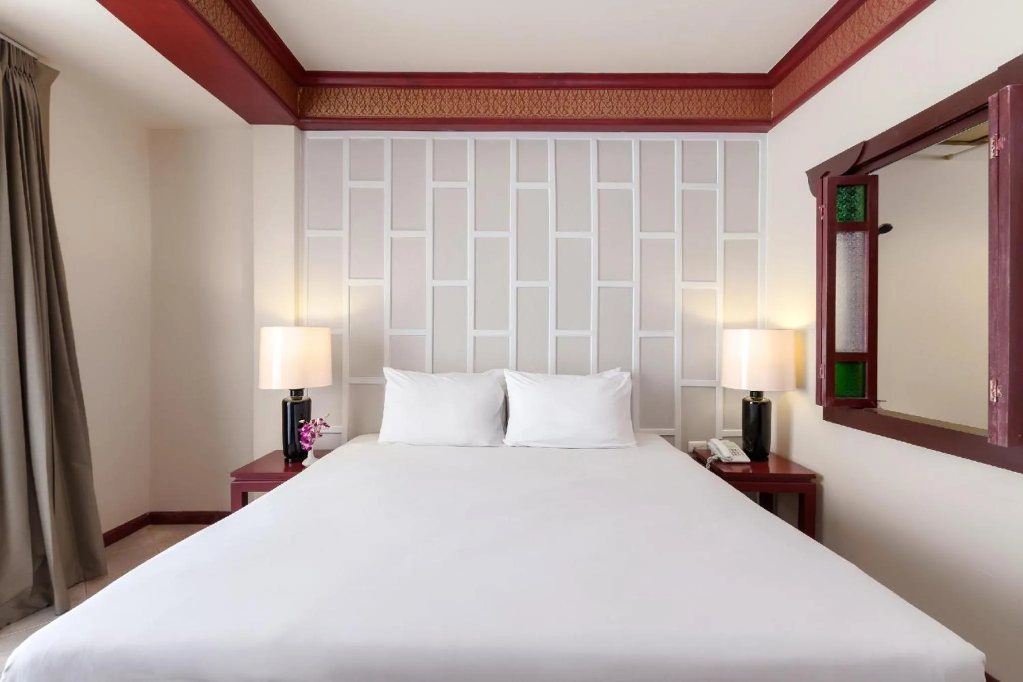 Bed in THE TOP PATONG RESORT.