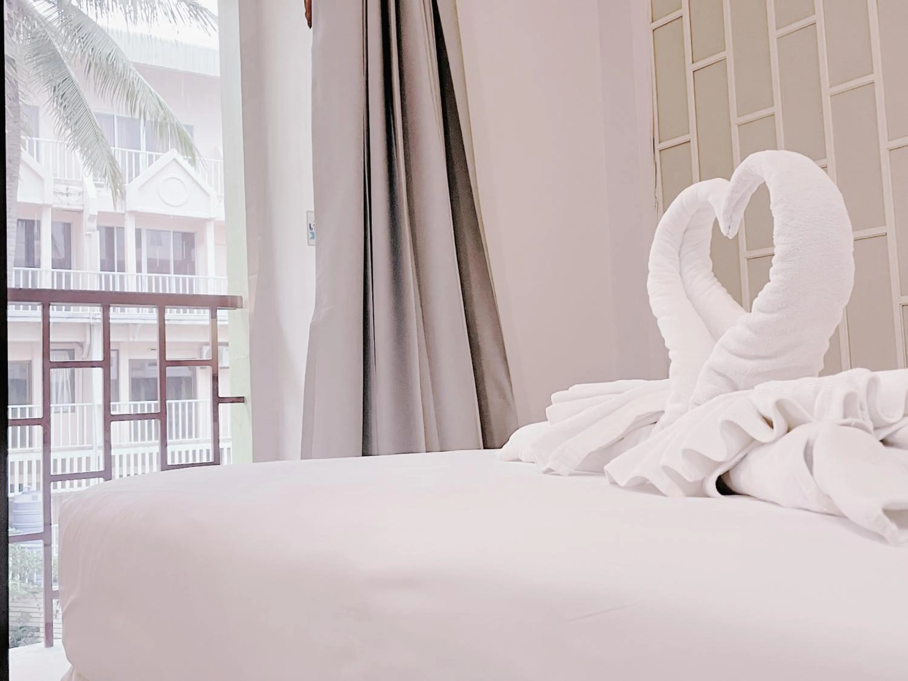 Bed in THE TOP PATONG RESORT.