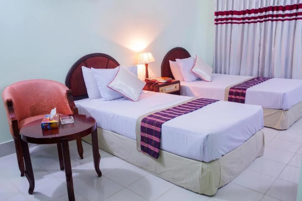 Bed in Meridian Hotel & Restaurant